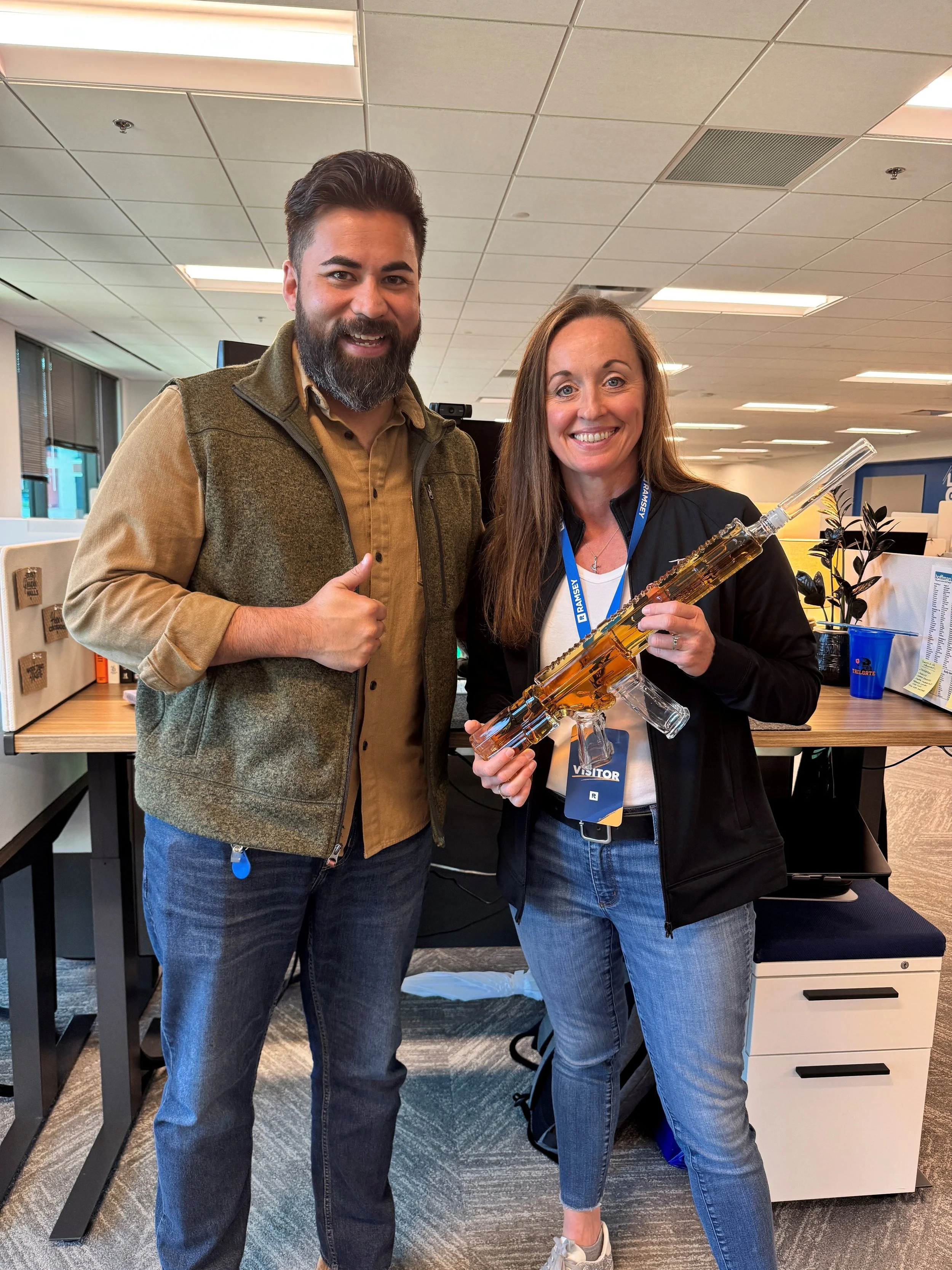 Shelly with SmartVestor Pro Coach (and tour guide) Justin Nguyen. Shelly got a tour of the offices where all the magic happens.