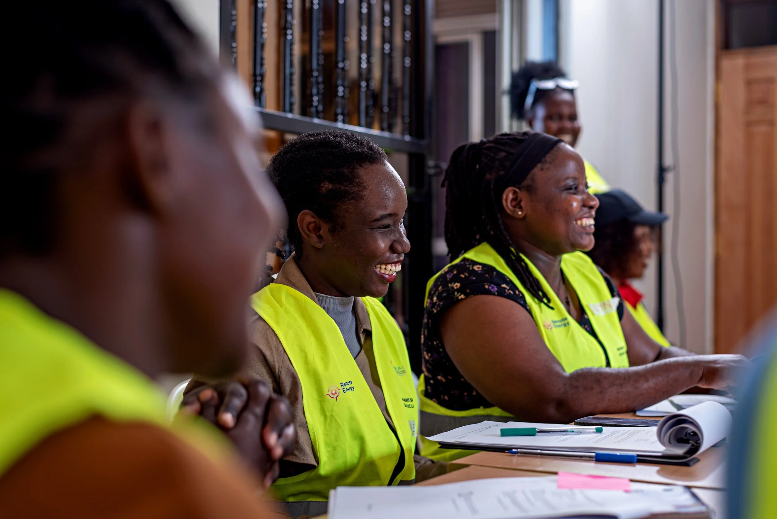 WREA students smiling classroom PC_ Giovanni Okot.jpg