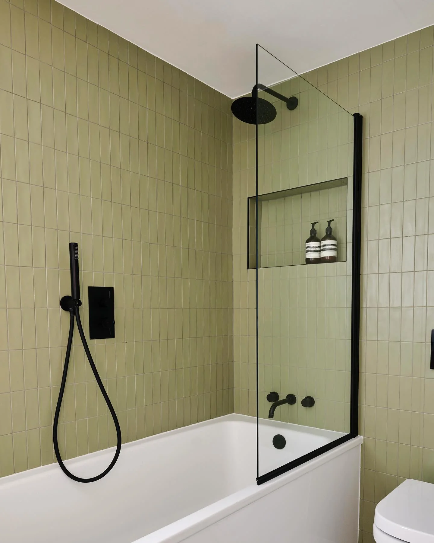 Moody Greens, Sleek Blacks&hellip;A Green and Black Bathroom That&rsquo;s Equal Parts Edgy and Elegant😍 @claybrookstudio 

#bathroom #bathroomdesign #interiordesign #design #bathroomdecor #kitchen #homedecor #home #interior #shower #renovation #arch