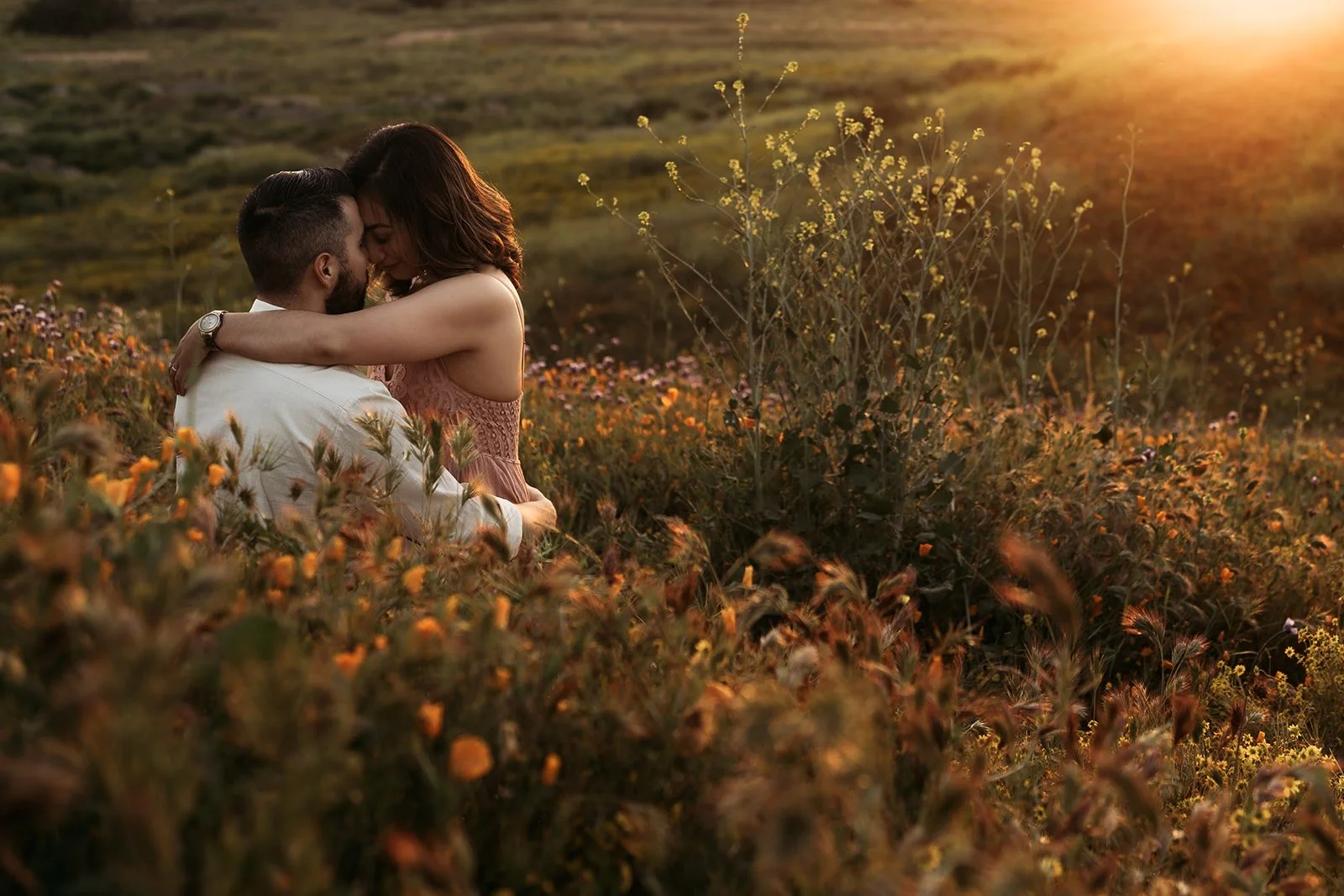 Southern California elopement photographer captures couple in a poppy field during sunset. this moody, rich edit is in Riverside California.