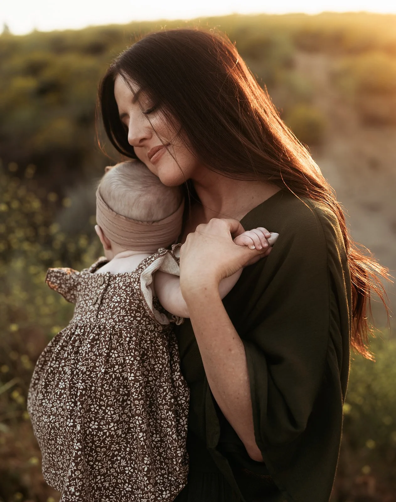 Southern California family photographer captures mother and daughter snuggling at sunset in sycamore canyon park in riverside California.