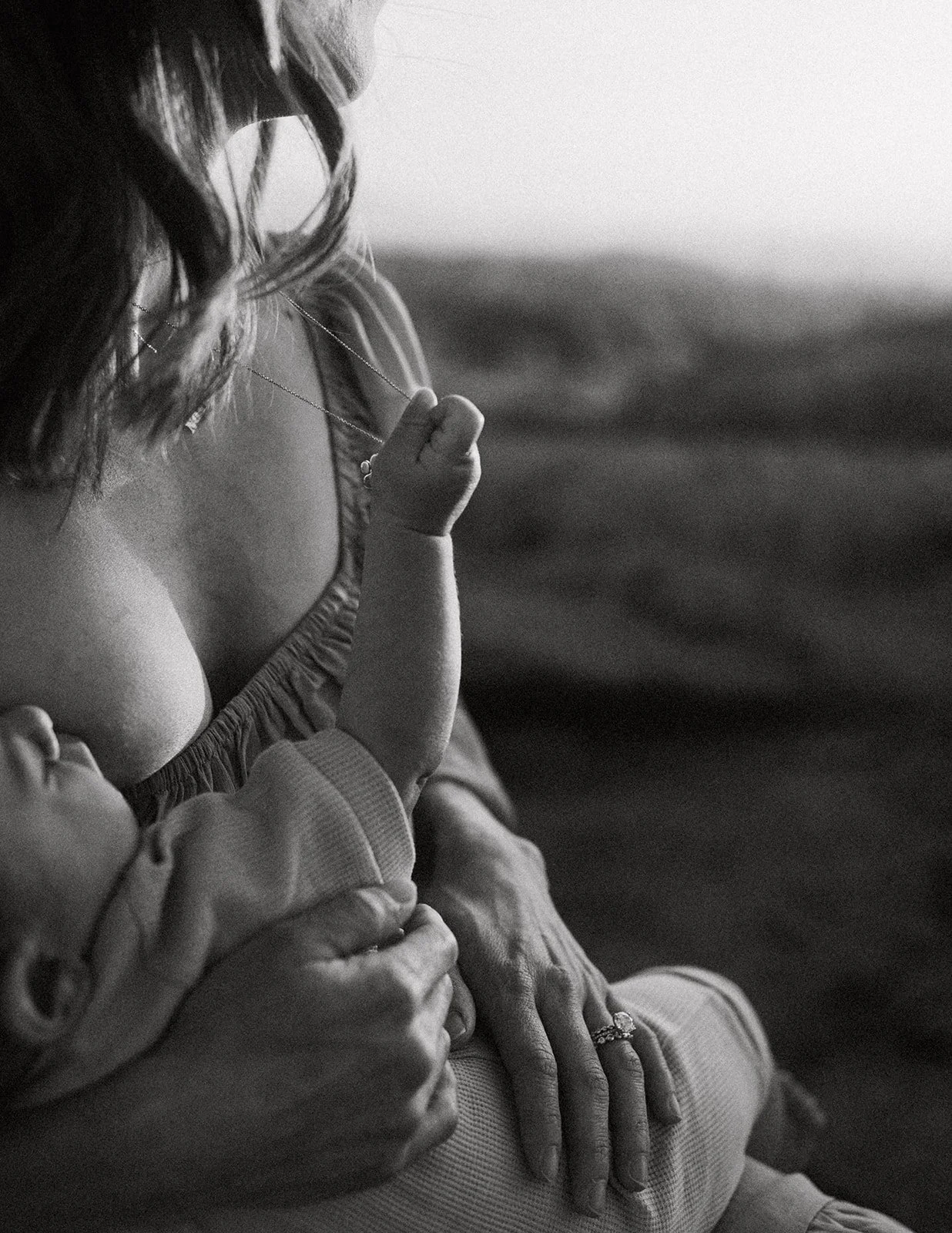 Southern California family photographer captures mother breastfeeding in this rich, moody edit at sycamore creek park in riverside California.