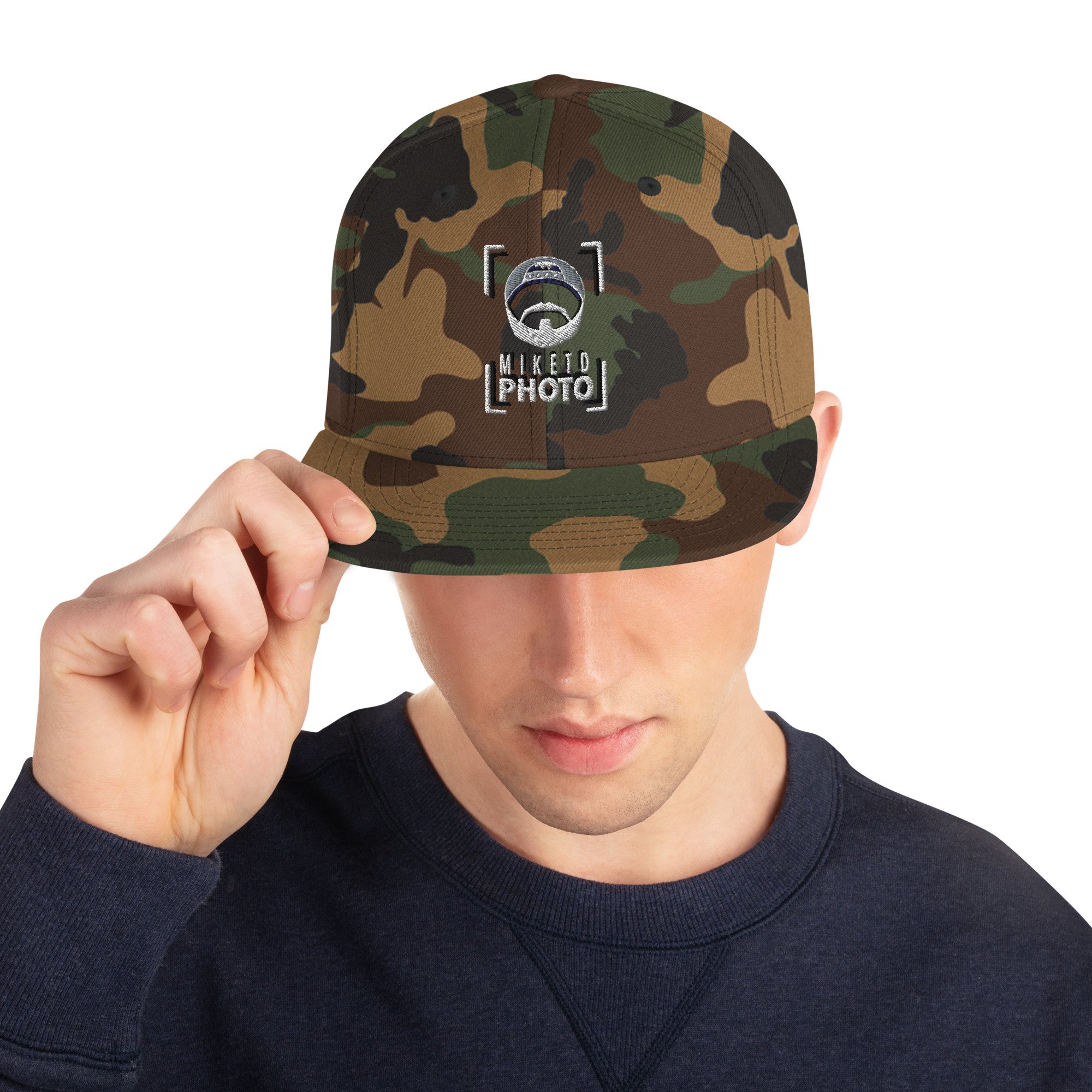 classic-snapback-green-camo-front-65cd9b2a61f4b.jpg