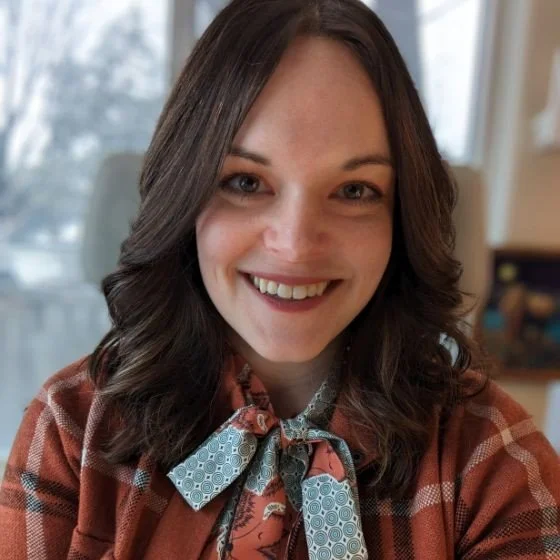 A young woman smiling at the camera
