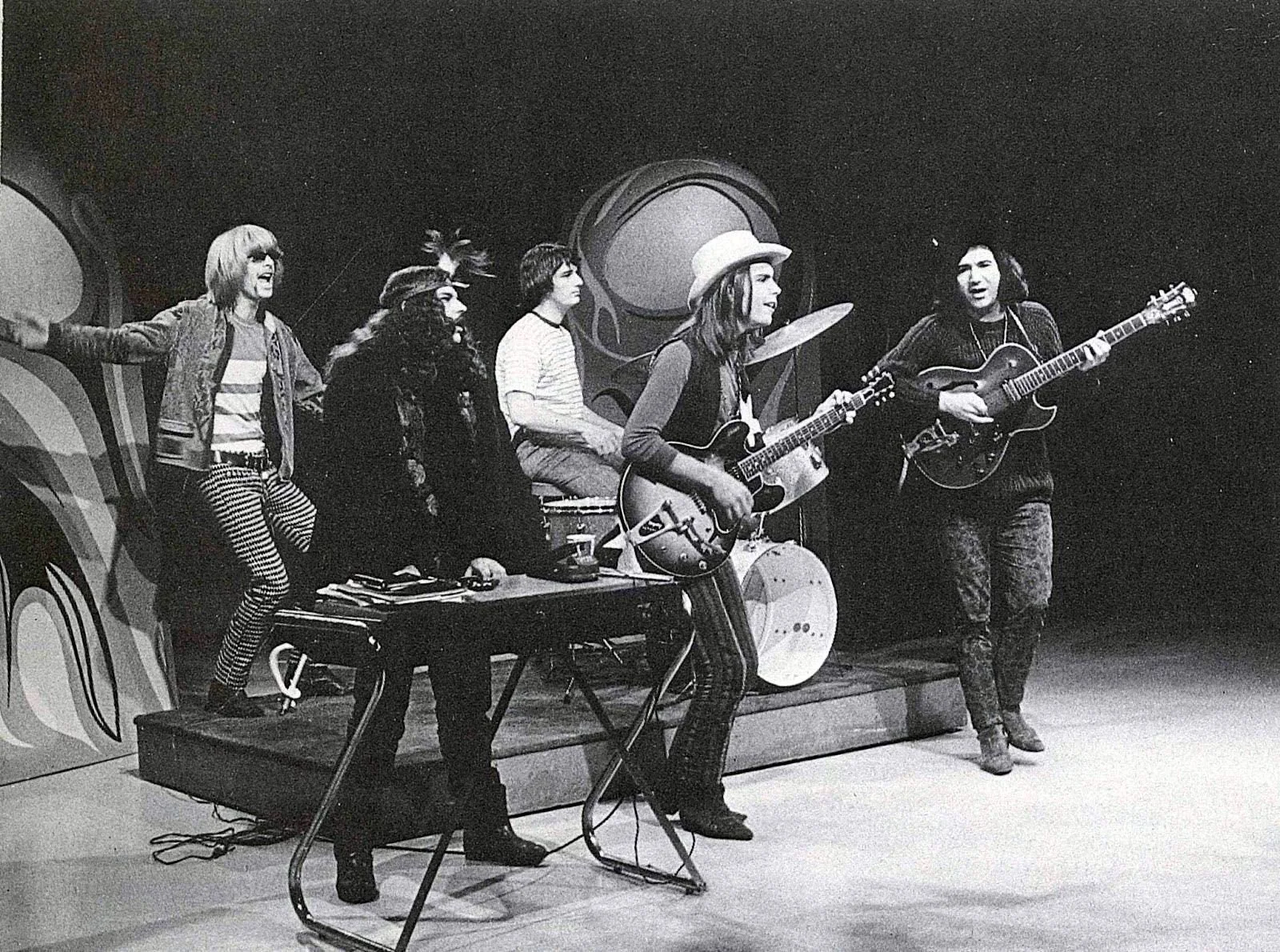 A band wearing hats and playing music together
