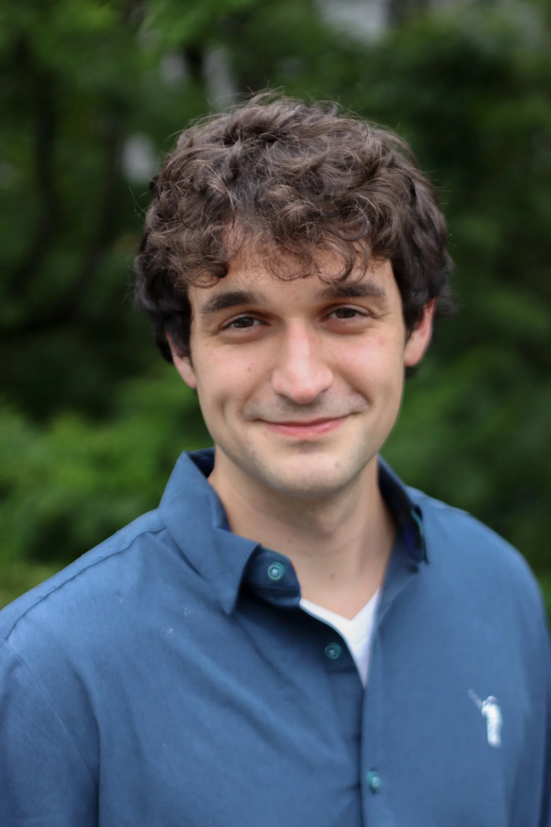  person in a blue shirt smiling