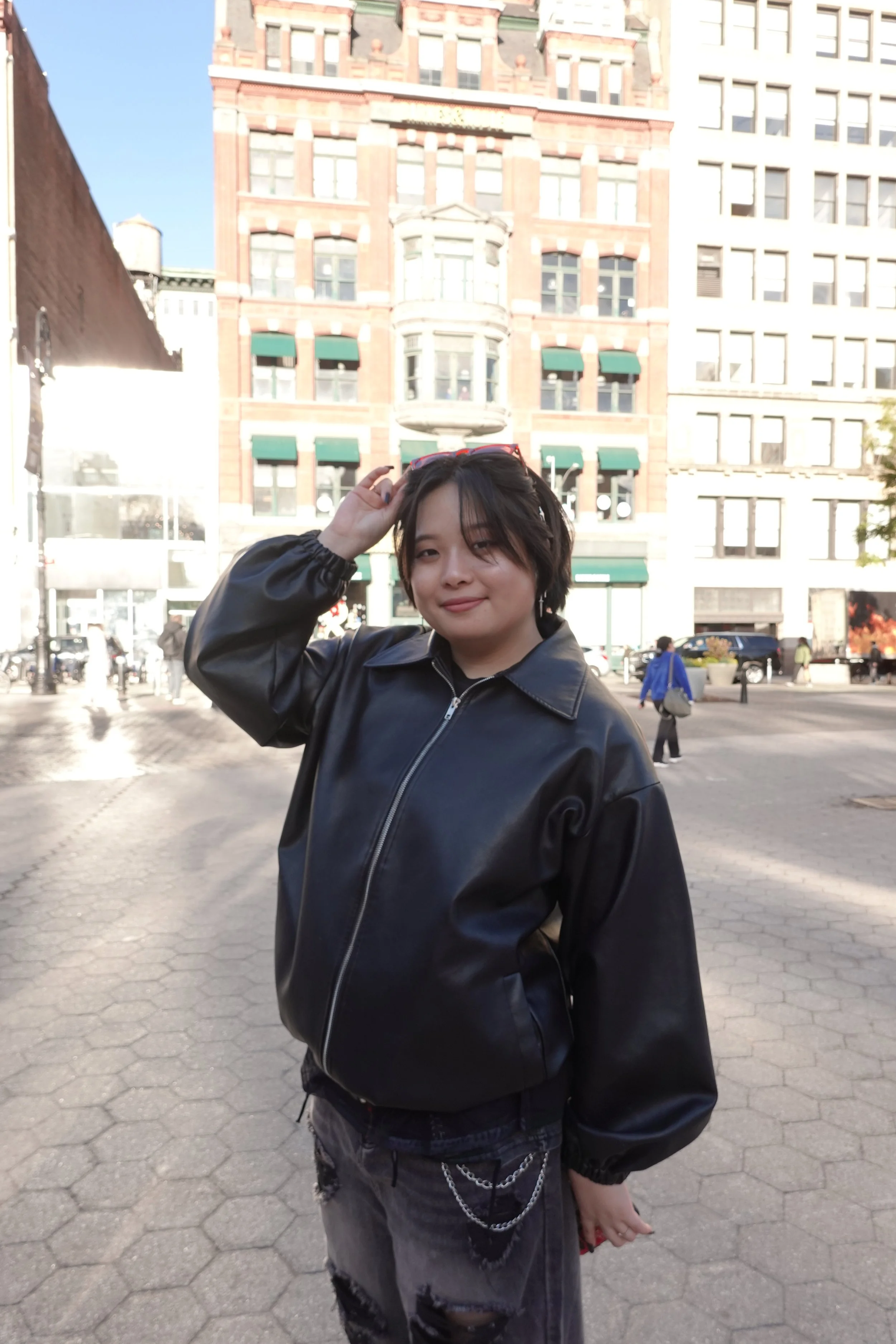 person smiling in a city