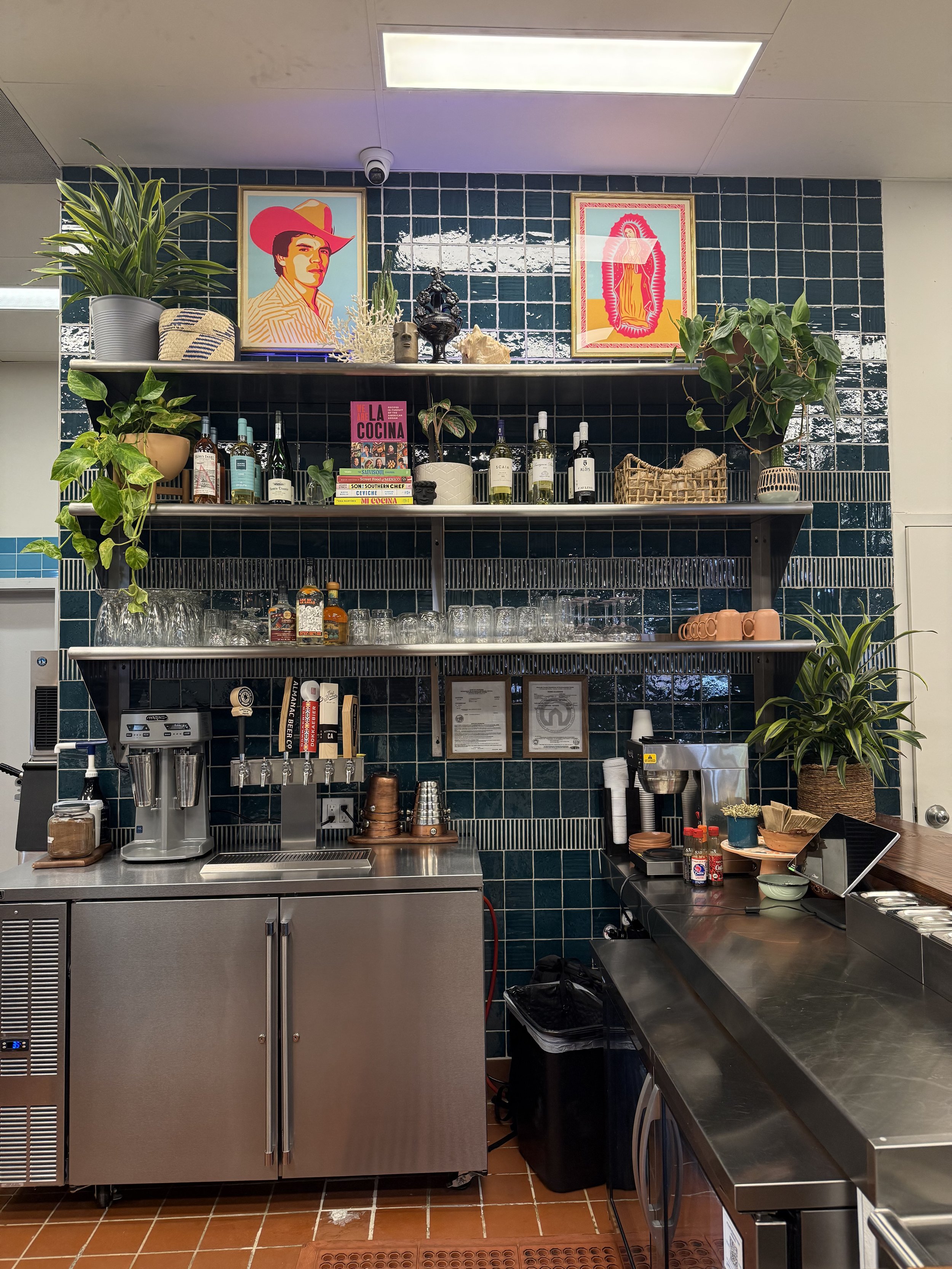 Restaurant bar shelving on blue tile