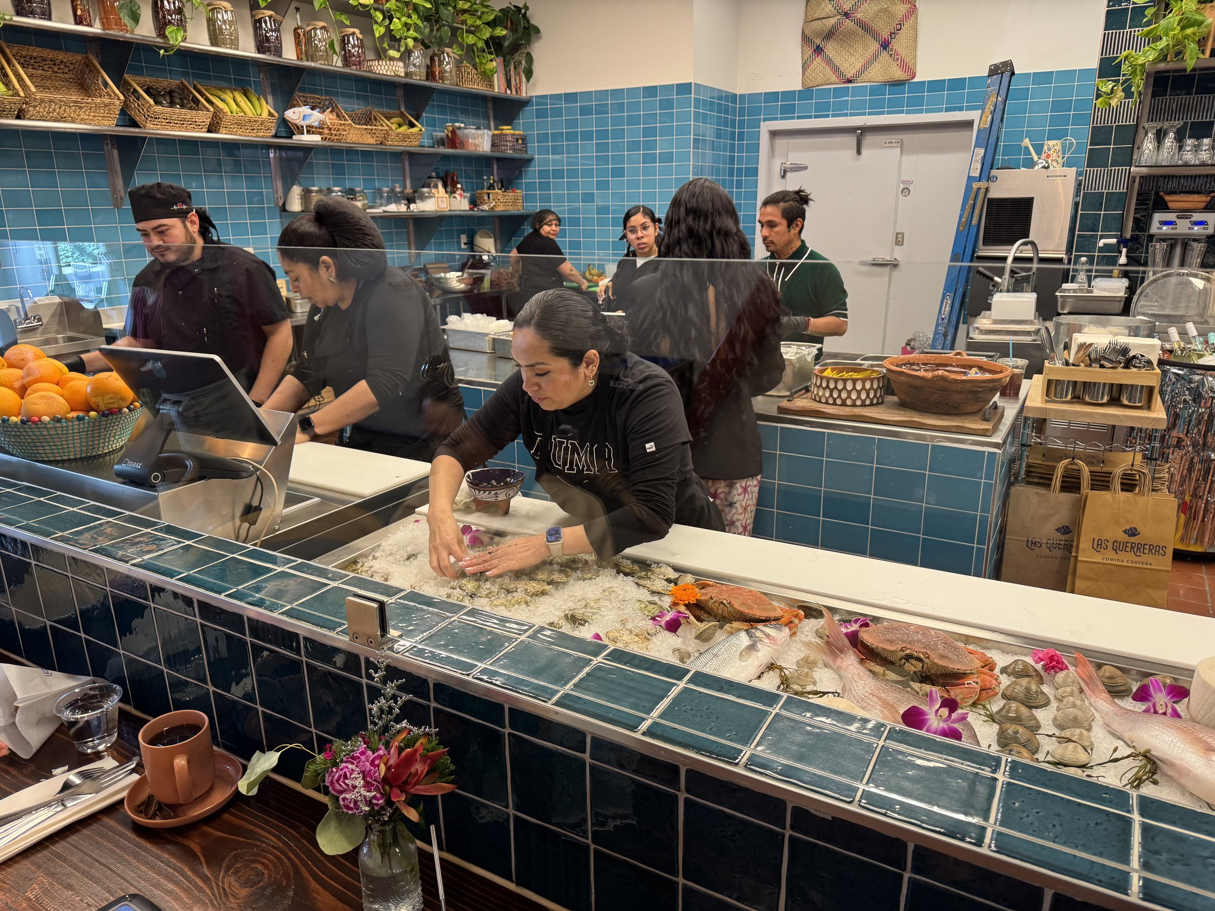 Seafood display at restaurant with blue tile