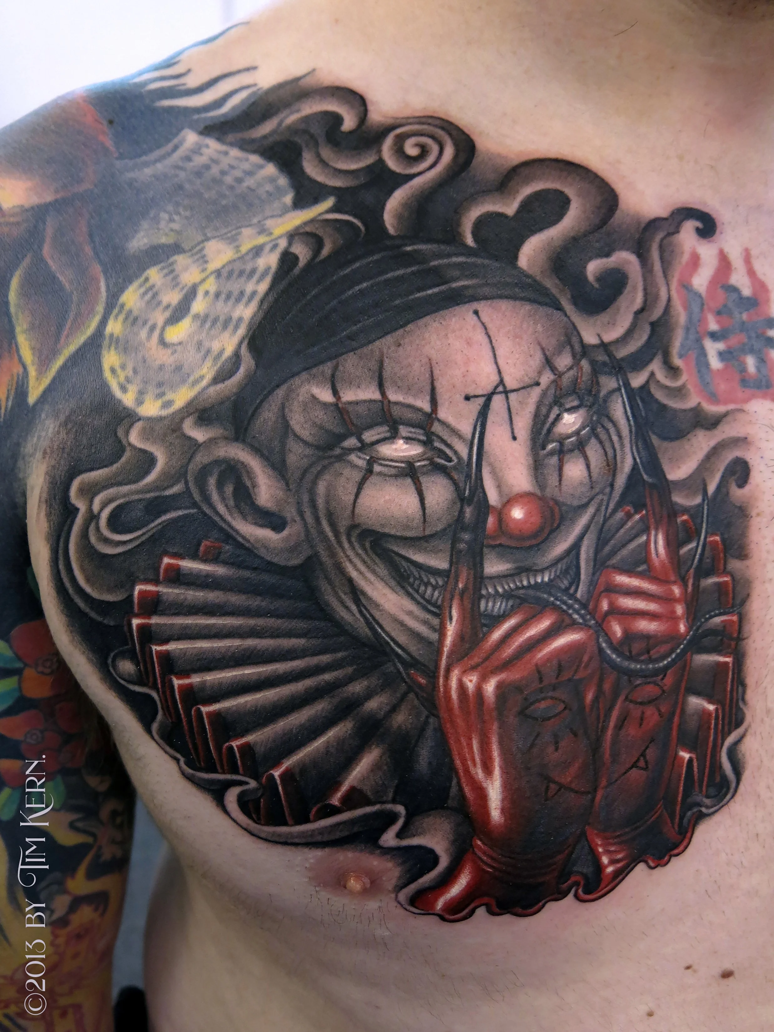 Harlequin-Clown-Demon-Smiley-Face-Chest-Tattoo.jpg