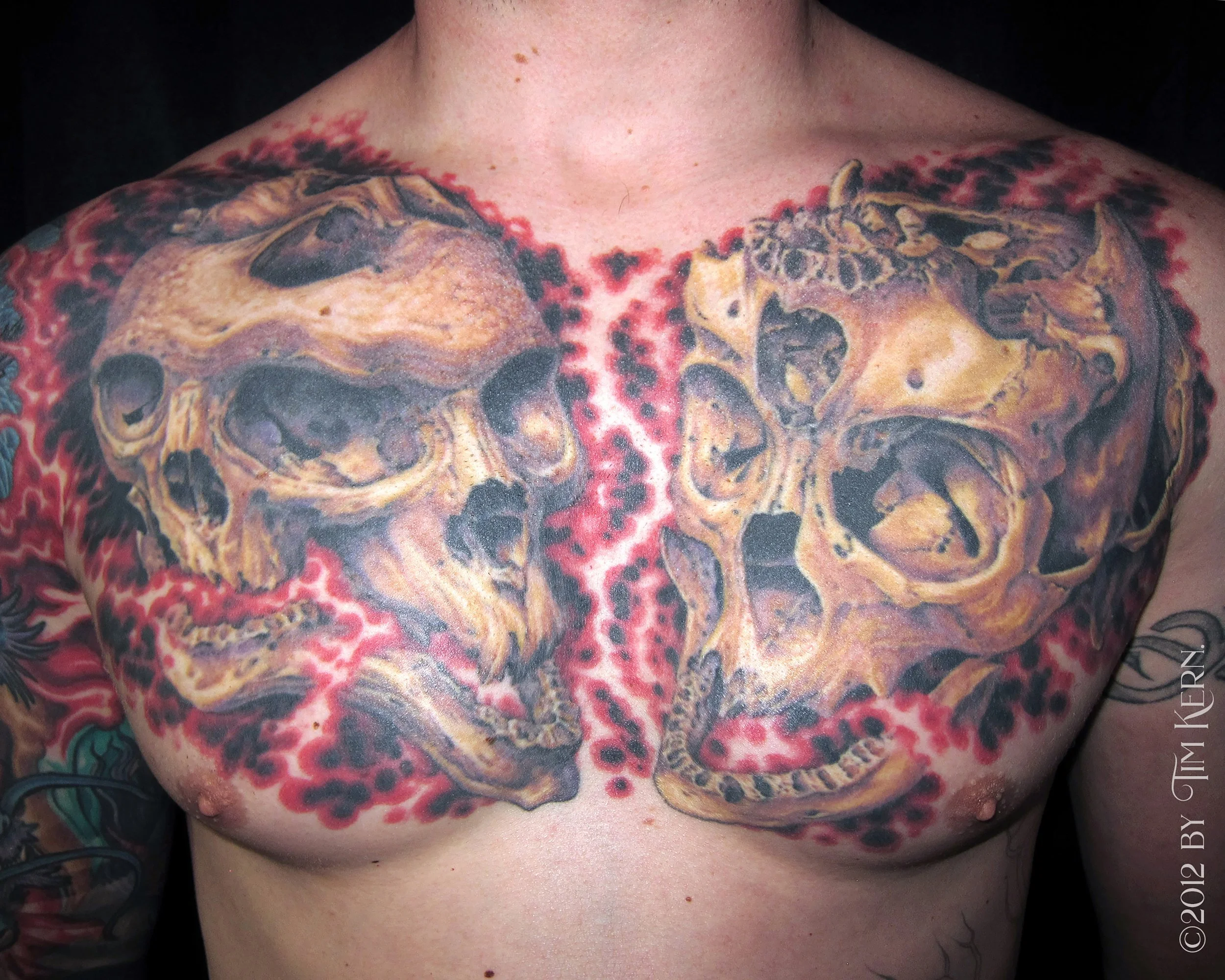 Triple-Skulls-Realism-Surrealism-Chestpiece-Tattoo.jpg