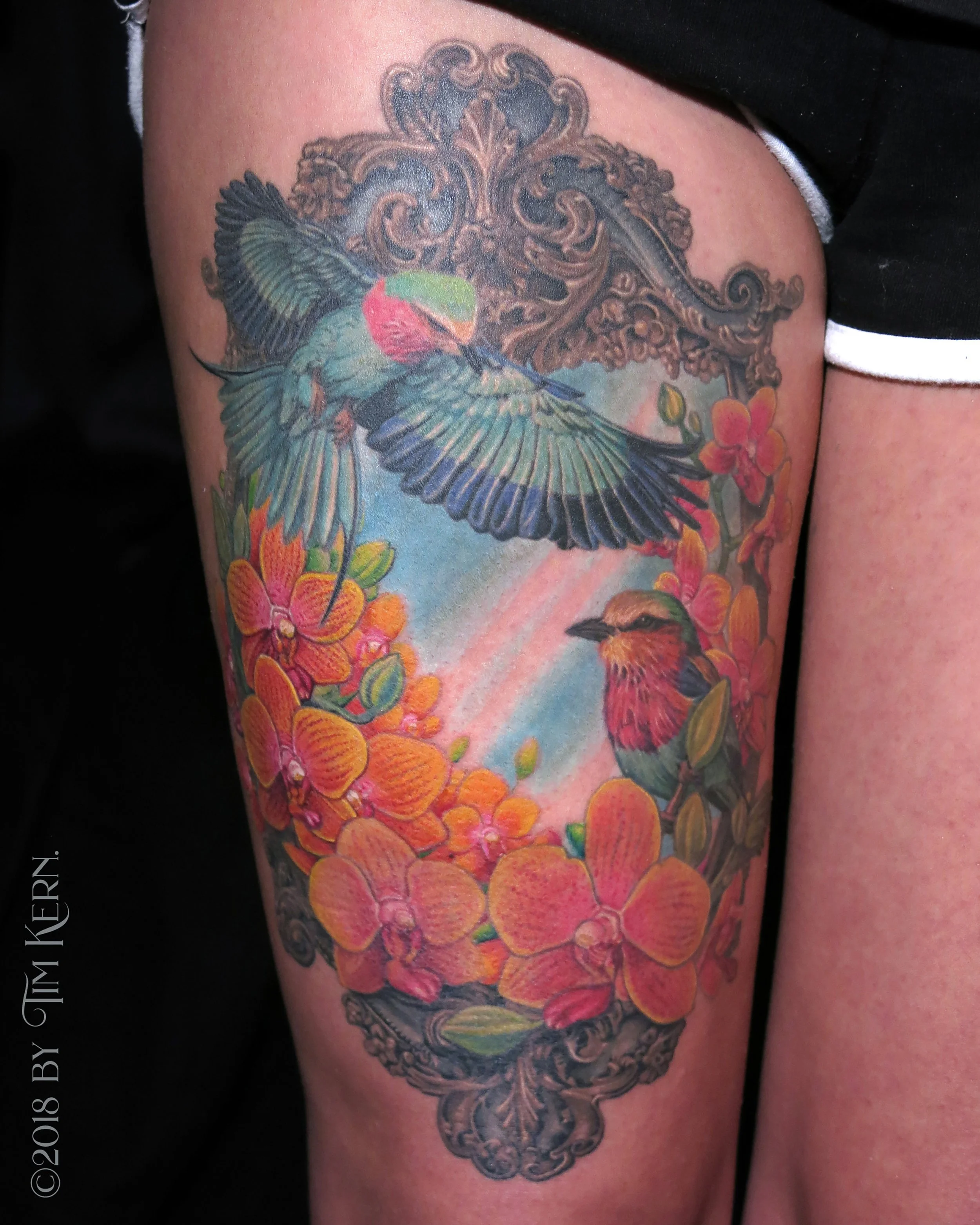Ruby-Throated-Roller-Orchids-Realism-Bird-Frame-Tattoo.jpg