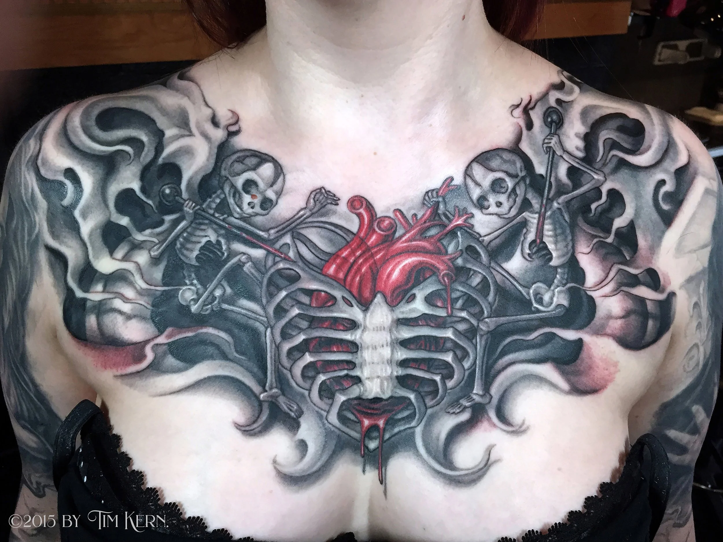 Bone-Ribcage-Heart-Fetal-Skeleton-Chestpiece-Female-Tattoo.jpg