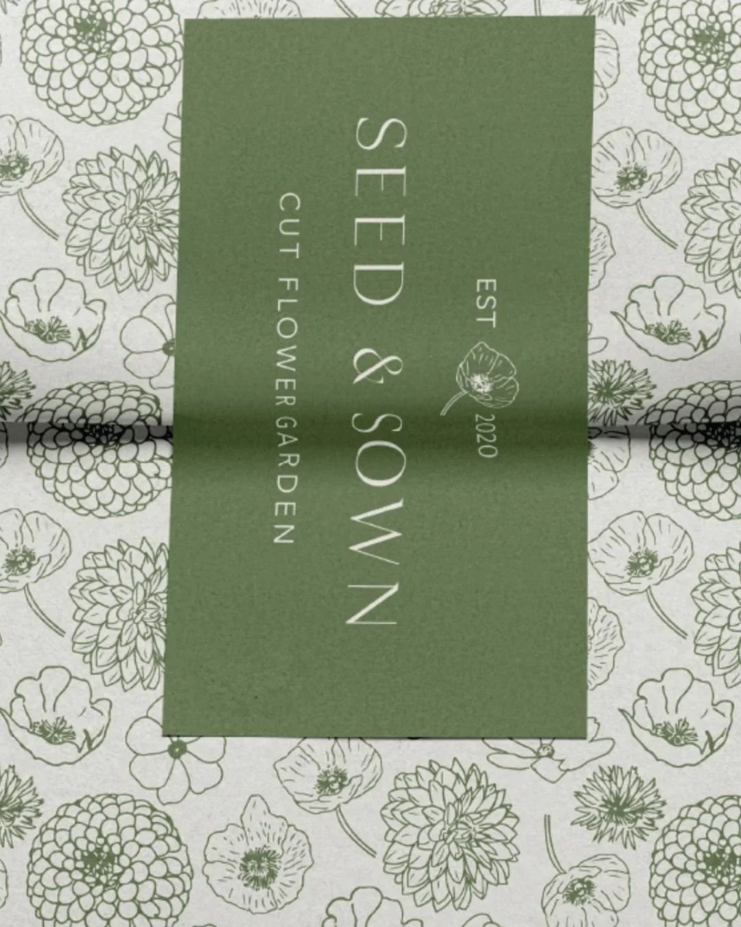 Green and white floral patterned packaging with a green rectangular label in the center that reads "Seed & Sow" and "Cut Flower Garden," established in 2020.