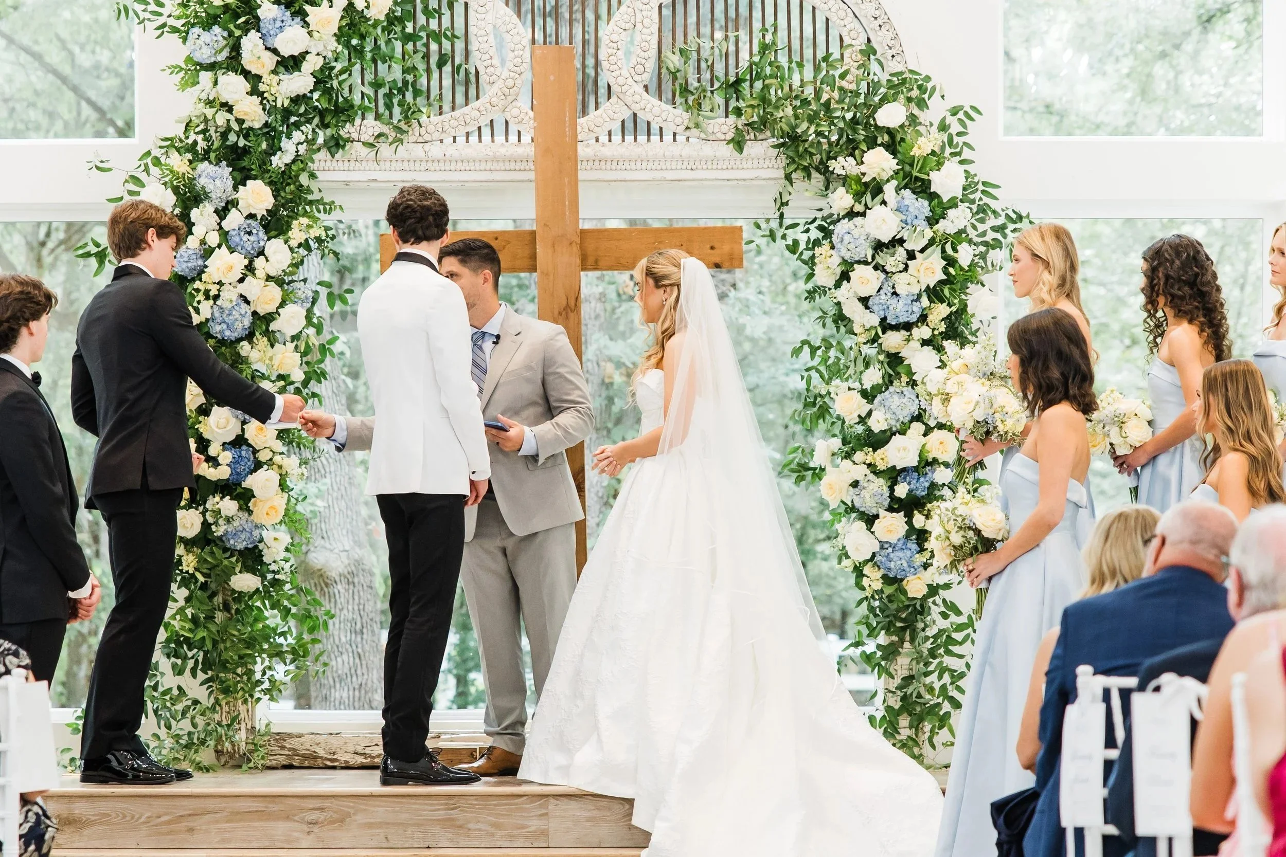 Bride and groom standing at the altar at The French Farmhouse wedding venue in Collinsville, Texas
