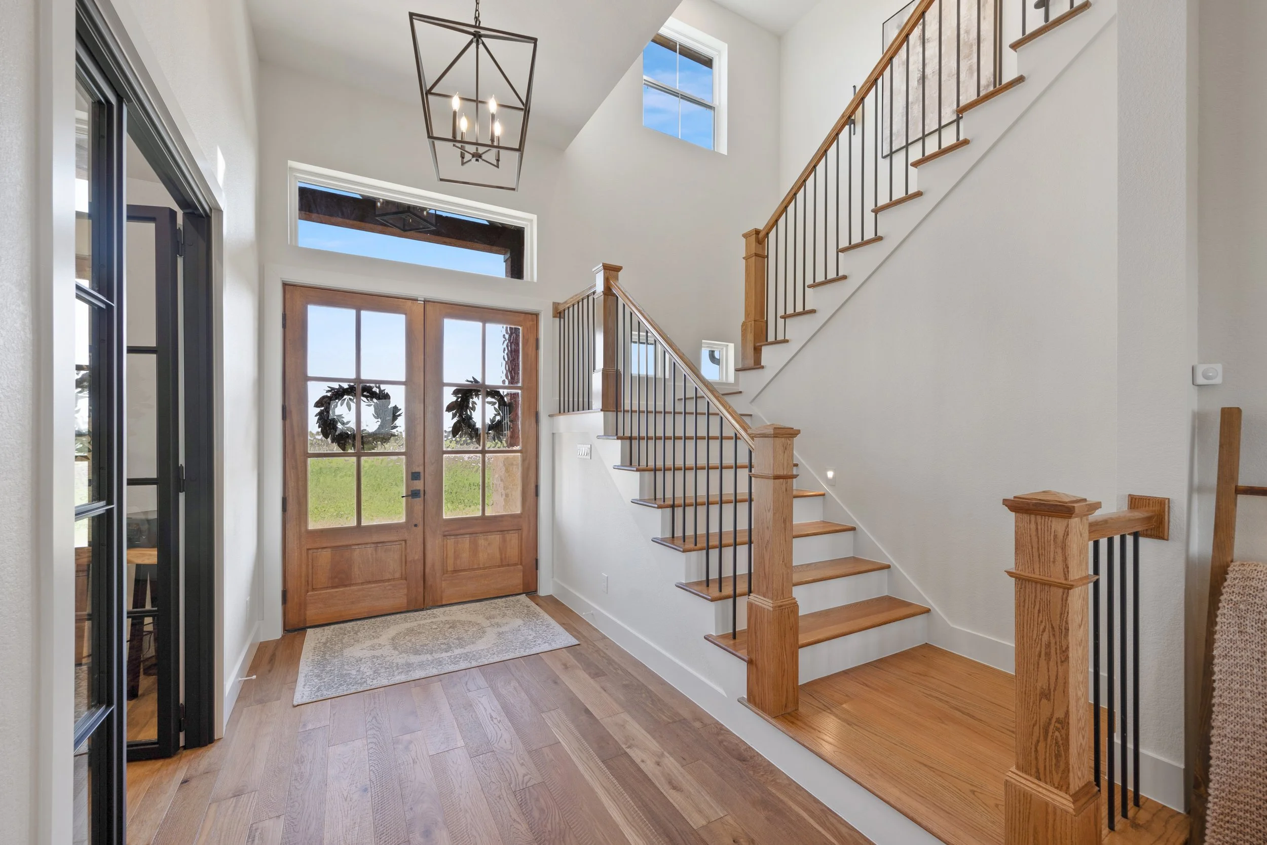 Luxury custom Ranch home in DFW with modern staircase and warm finishes