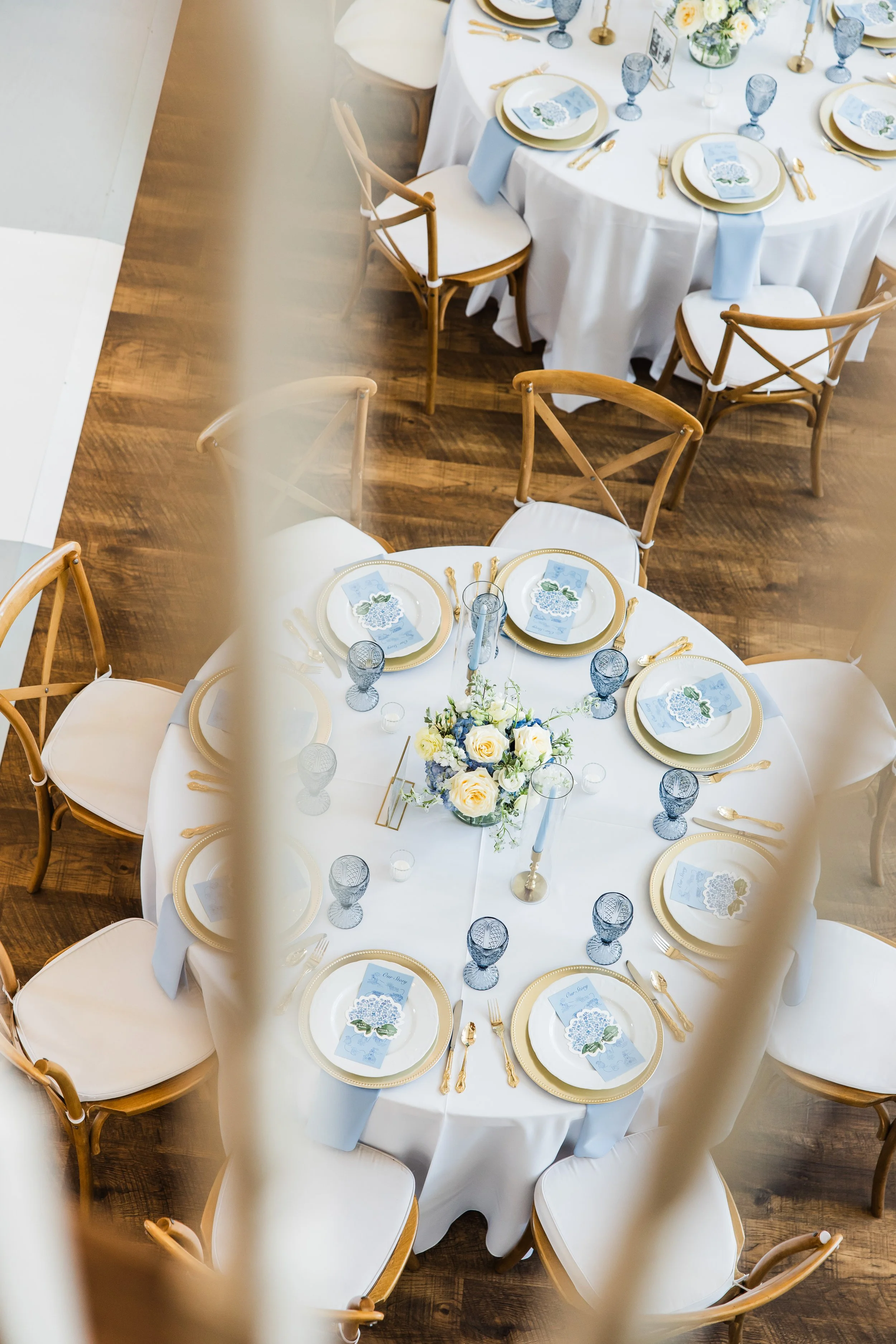 Blue and white reception tablescape at The French Farmhouse wedding