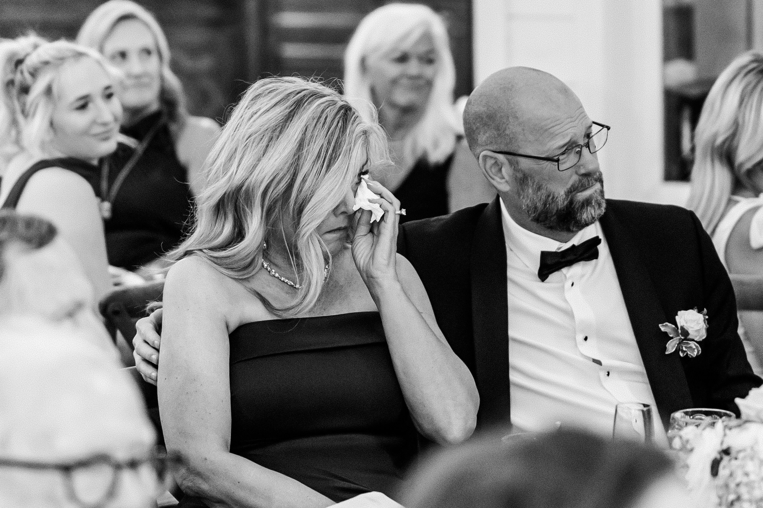 Emotinal parents wiping tears during the ceremony at the French Farmhouse Venue in Collinsville, TX