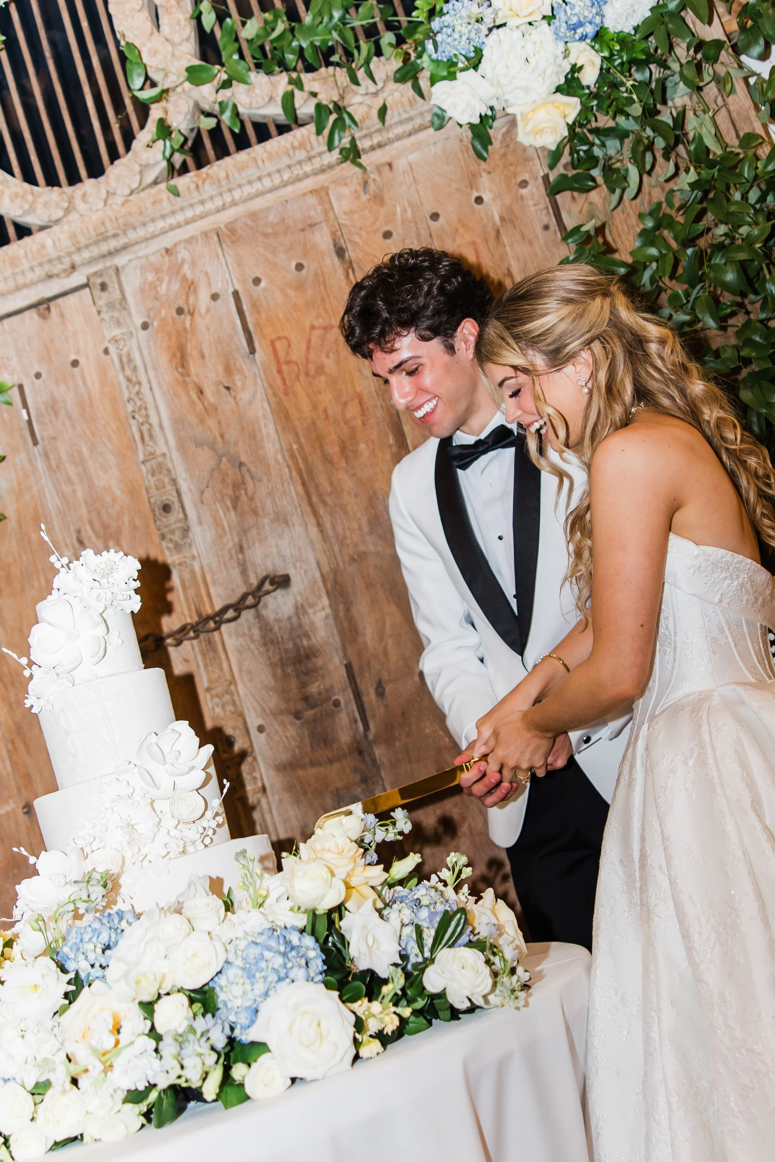 Cake cutting at the French Farmhouse Venue in Collinsville, TX