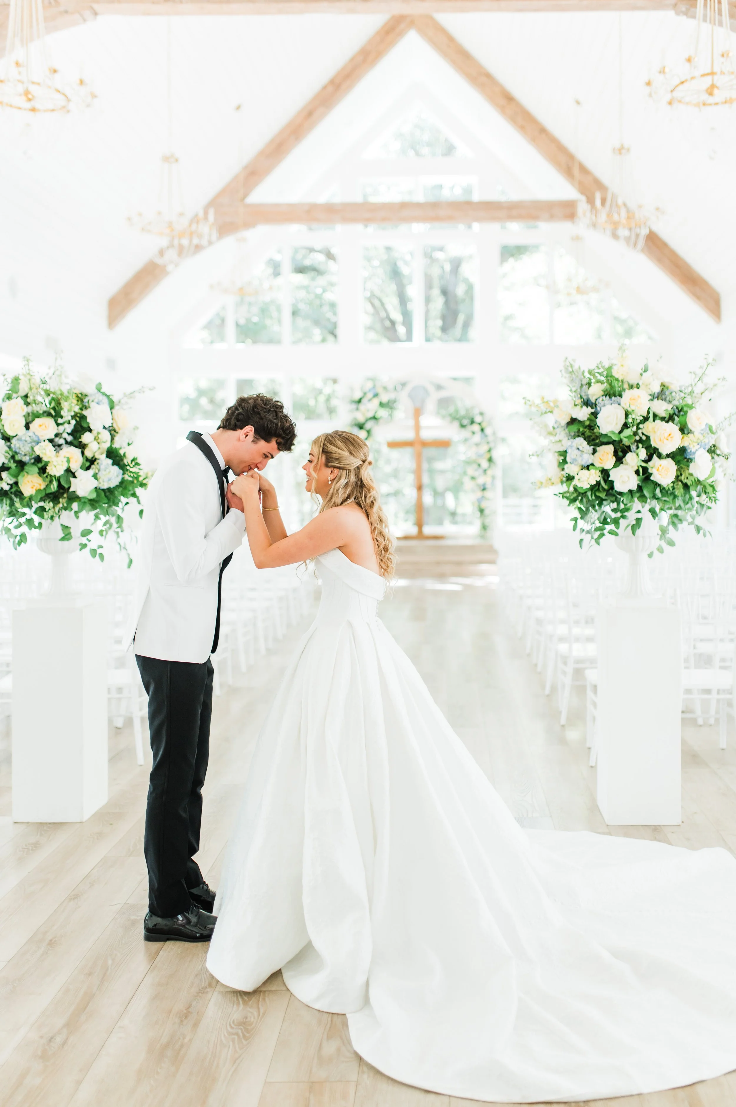 Bride's first look with the groom in the chapel at the french farmhouse venue in collinsville tx
