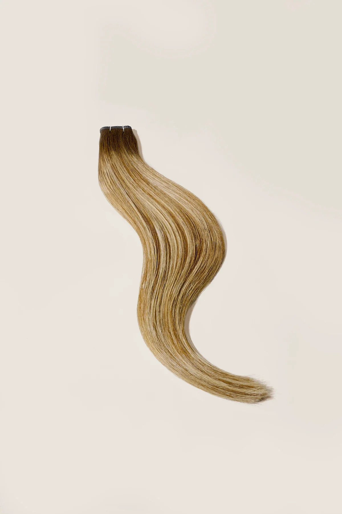 Hair extension product photography with beige background. Photo for e-commerce, campaigns, and marketing.