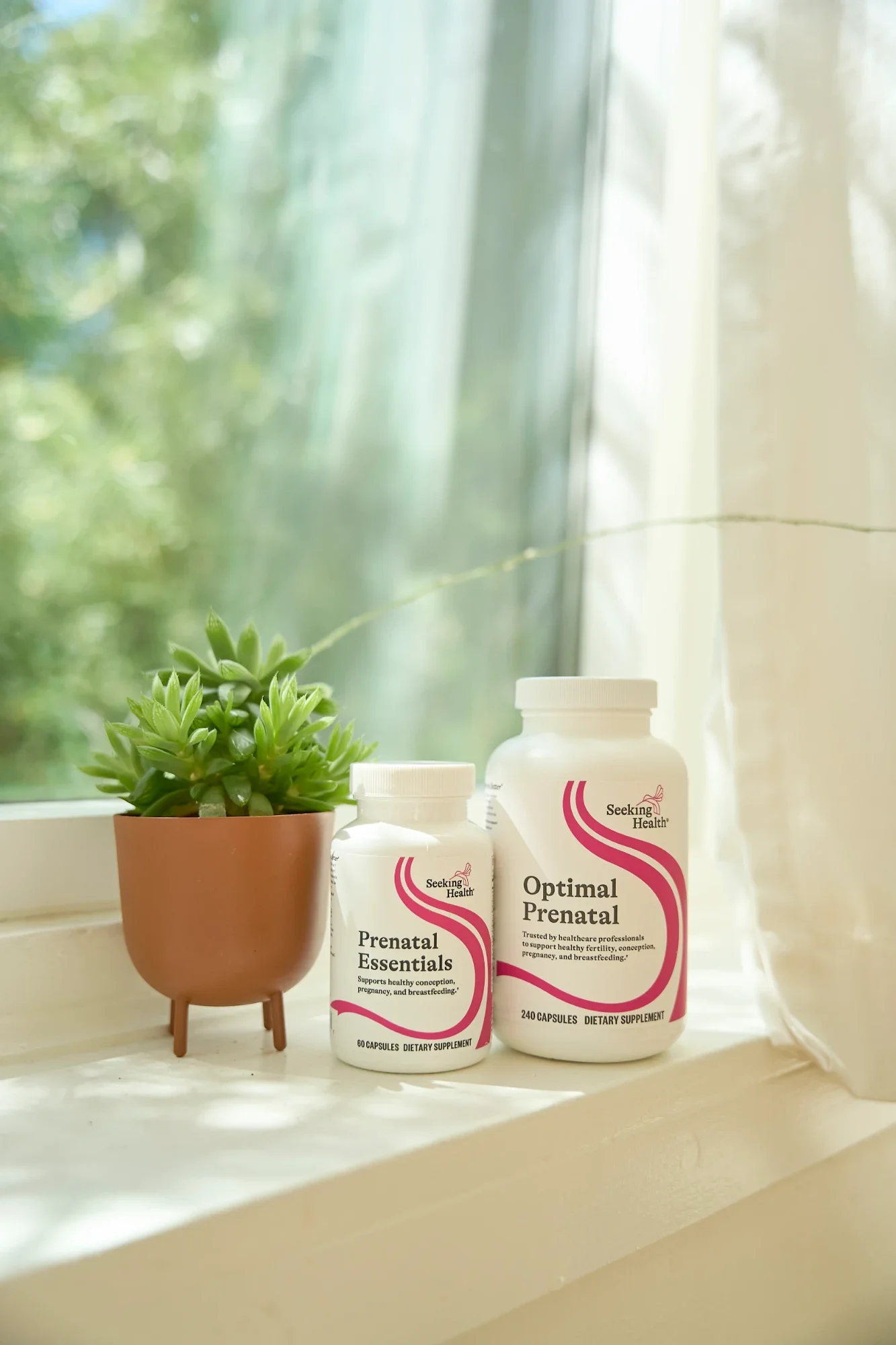Seattle luxury wellness product photography of a prenatal vitamins with lifestyle setting to highlight premium ingredients and wellness branding. Ideal for beauty, skincare, and wellness brands seeking clean, editorial visual content for e-commerce, 