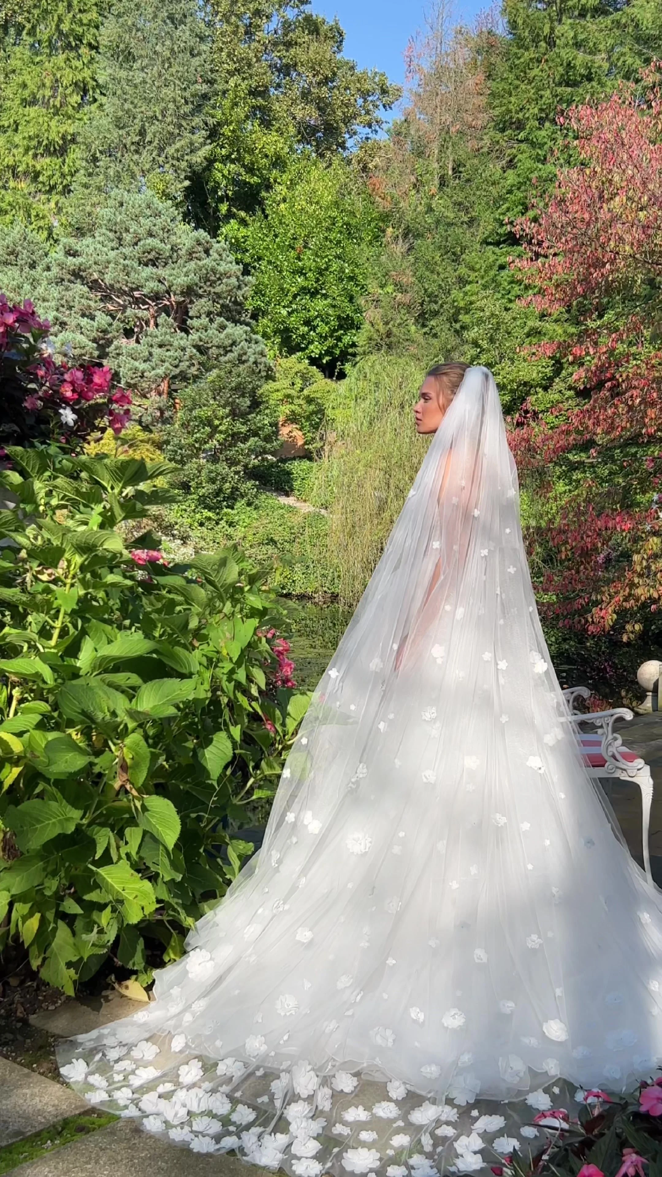Naomi cathedral-length bridal veil with delicate 3D floral appliqué on soft sheer tulle.