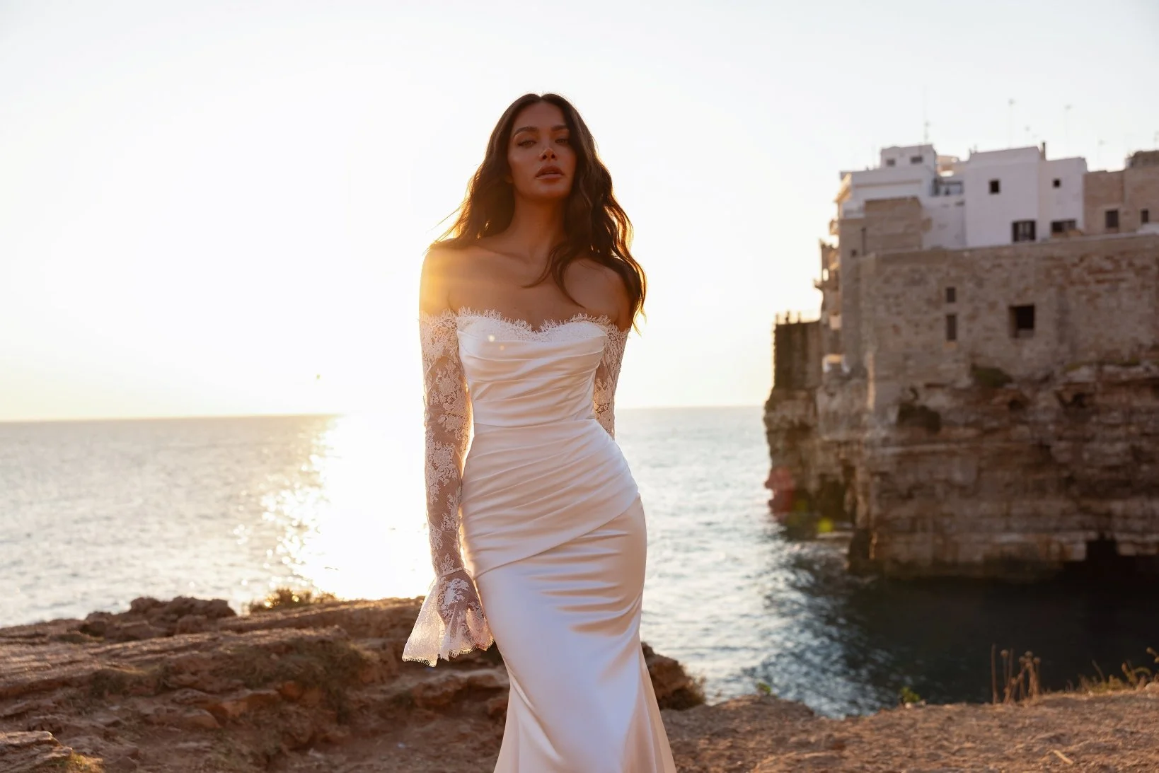 Crafted in luminous ivory satin and delicate Chantilly lace, the ARIANA fit-and-flare gown is the epitome of refined, sculpted elegance. Exclusive to Spellbound Bridal in Wicklow, Ireland.