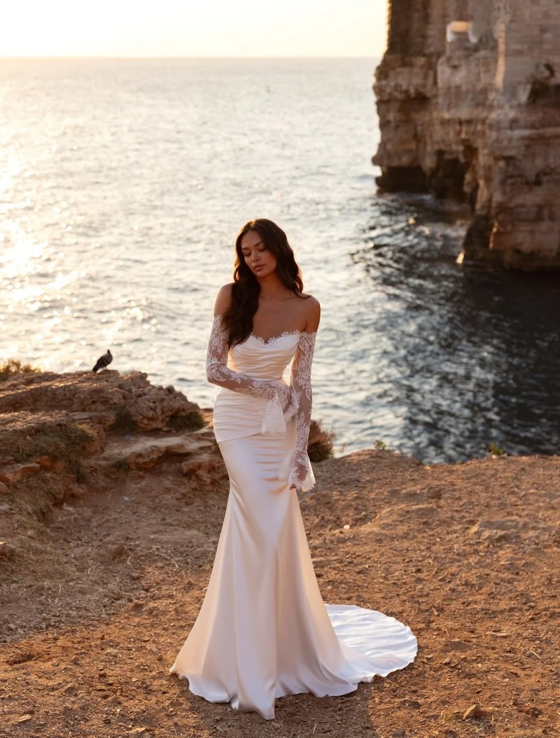 Crafted in luminous ivory satin and delicate Chantilly lace, the ARIANA fit-and-flare gown is the epitome of refined, sculpted elegance. Exclusive to Spellbound Bridal in Wicklow, Ireland.