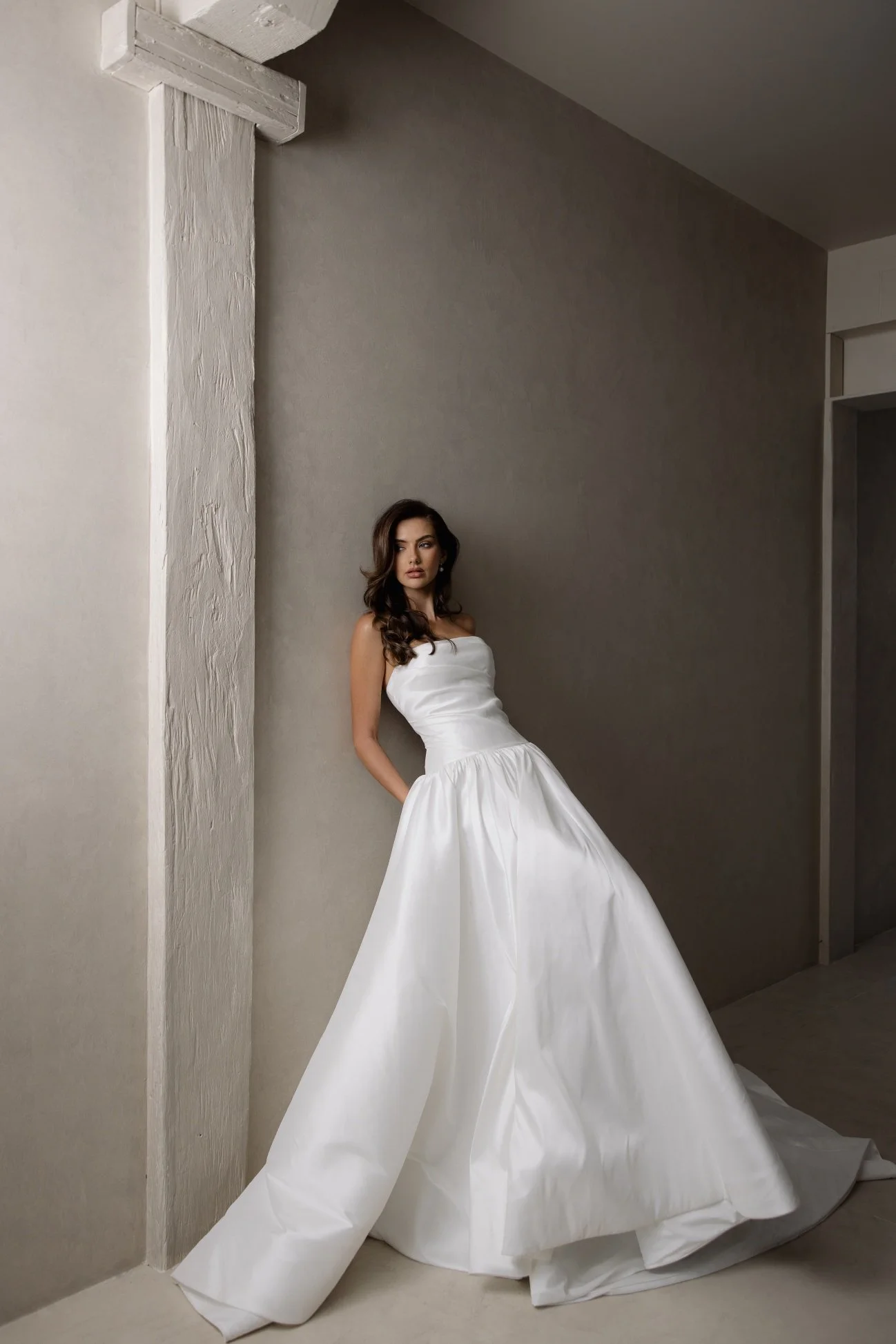 Aneta by Trish Peng stretch Mikado wedding dress featuring a modern drop waist, expertly ruched bodice and elegant A-line skirt, available at Spellbound Bridal Ireland.
