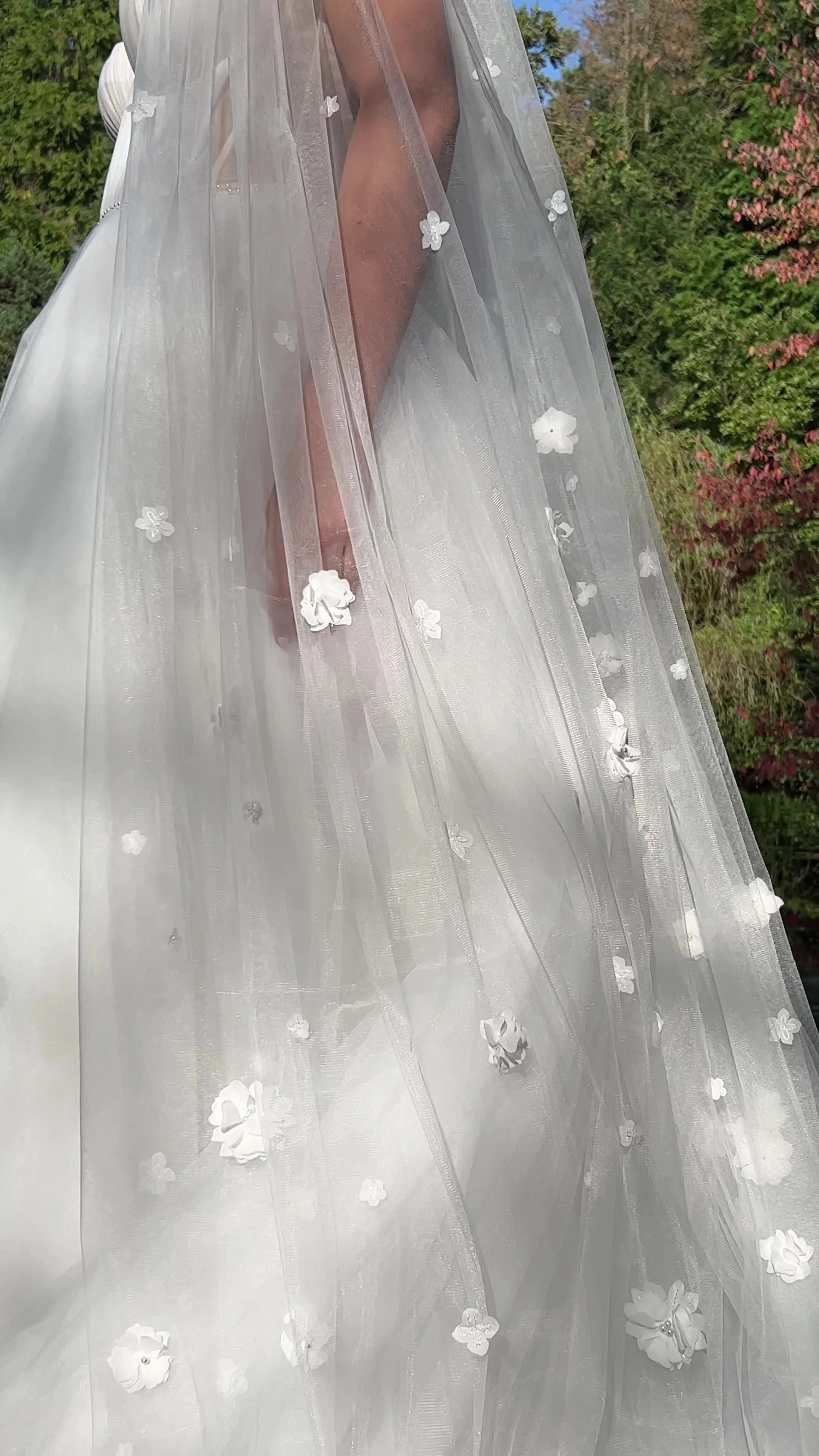 Naomi cathedral-length bridal veil with delicate 3D floral appliqué on soft sheer tulle.