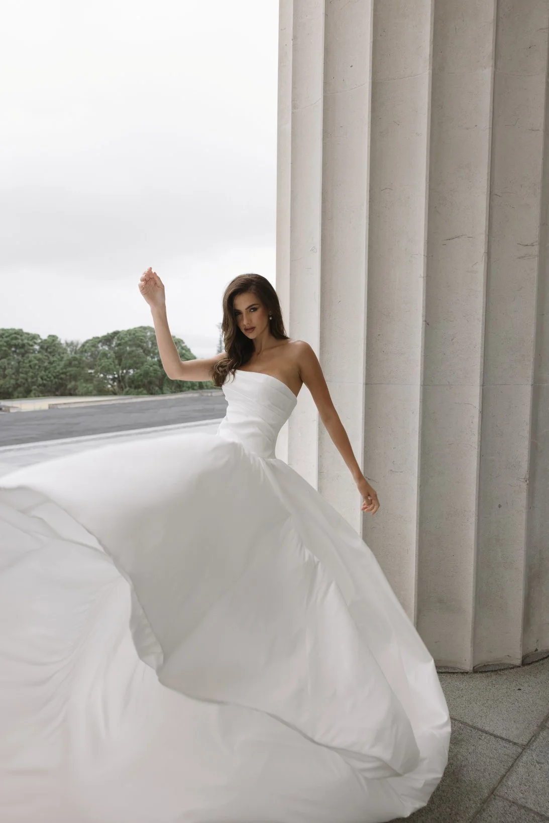 Aneta by Trish Peng stretch Mikado wedding dress featuring a modern drop waist, expertly ruched bodice and elegant A-line skirt, available at Spellbound Bridal Ireland.