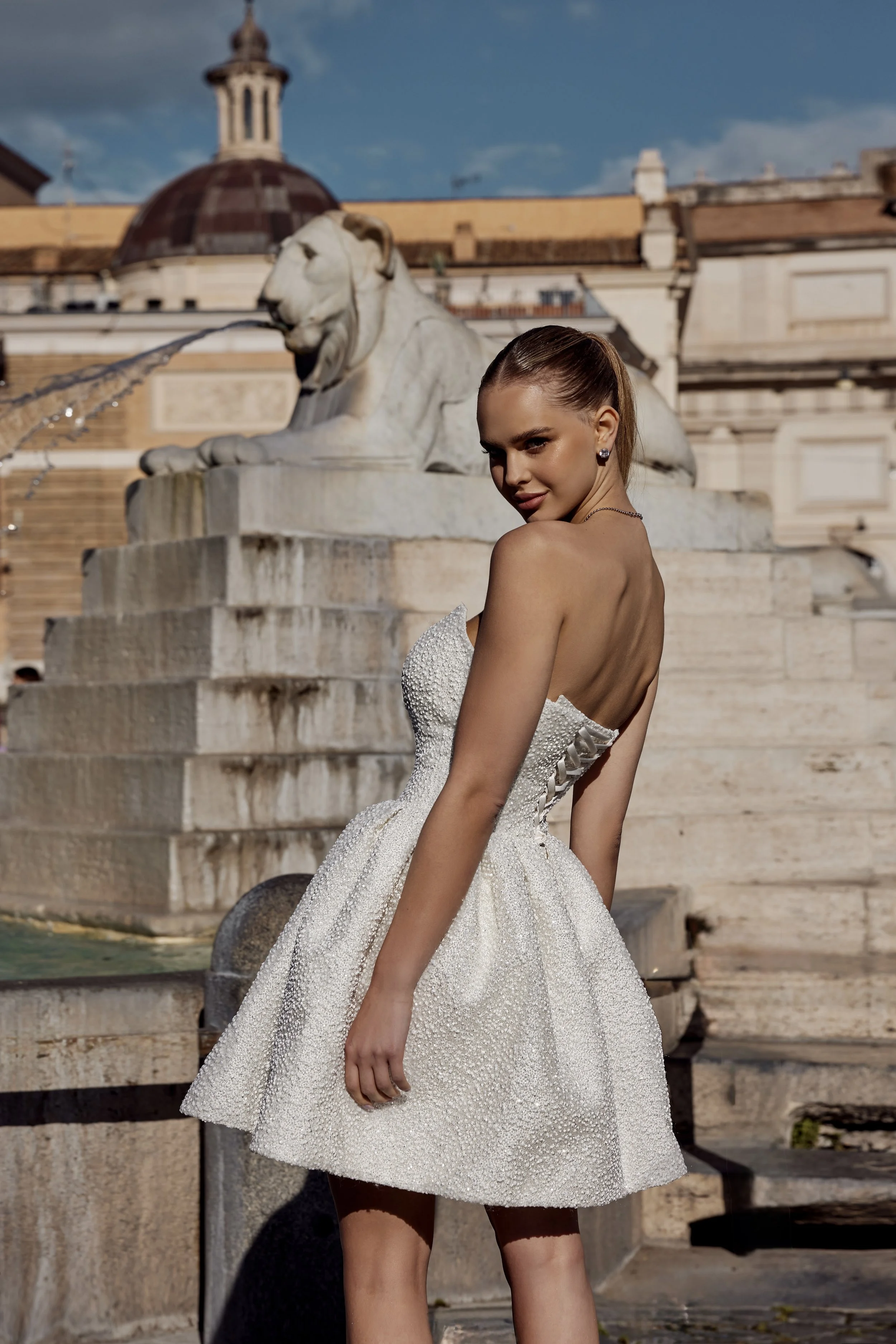 Asolo Bridal Mini created with a structured sparkle fabric and featuring a sweetheart corset, lace-up back and full mini skirt. Luxury short wedding dress exclusive to Spellbound Bridal Ireland.