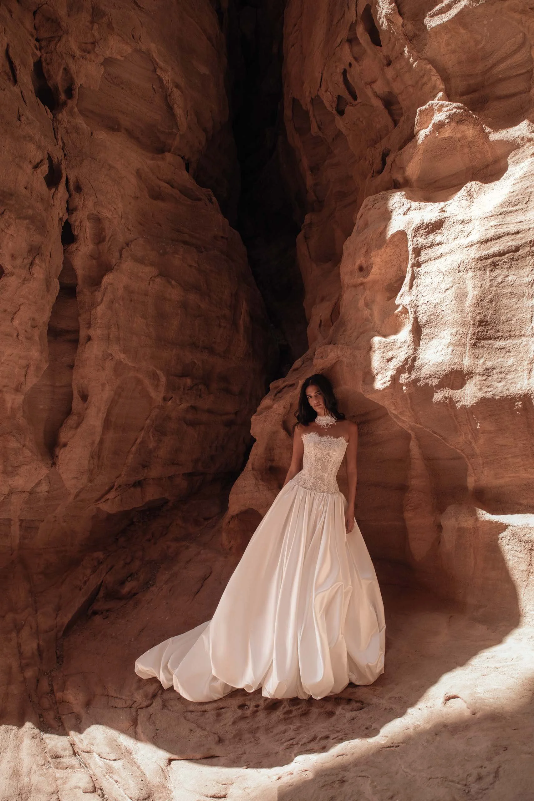 Discover the AMAYA wedding dress by Katy Corso at Spellbound Bridal. A strapless lace corset gown with dropped waist and voluminous satin bubble skirt.