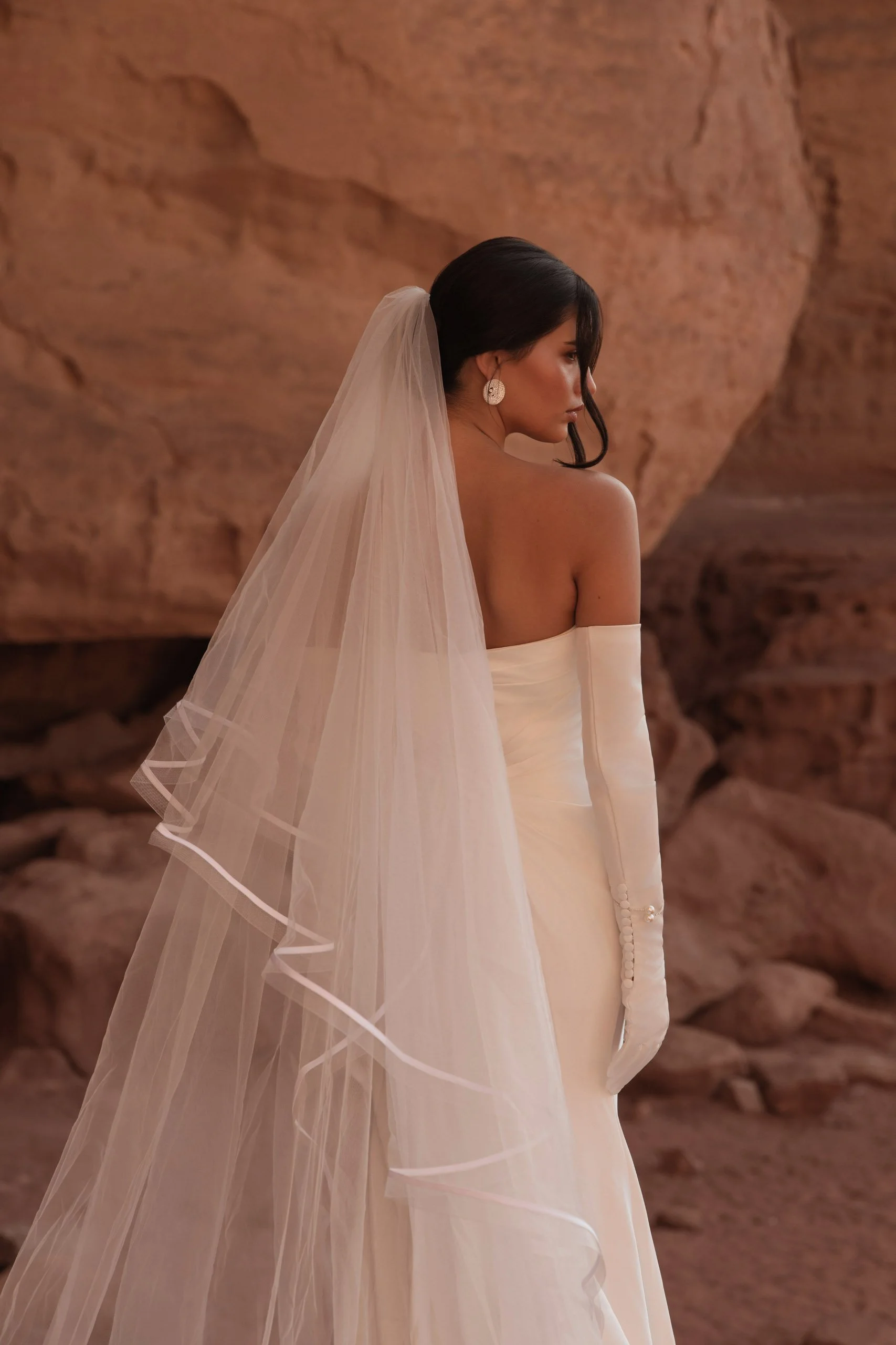 Crafted in luminous ivory satin, ORI is the bridal gown embodiment of modern goddess elegance. Designer: Katy Corso. Exclusive to Spellbound Bridal, Wicklow, Ireland.