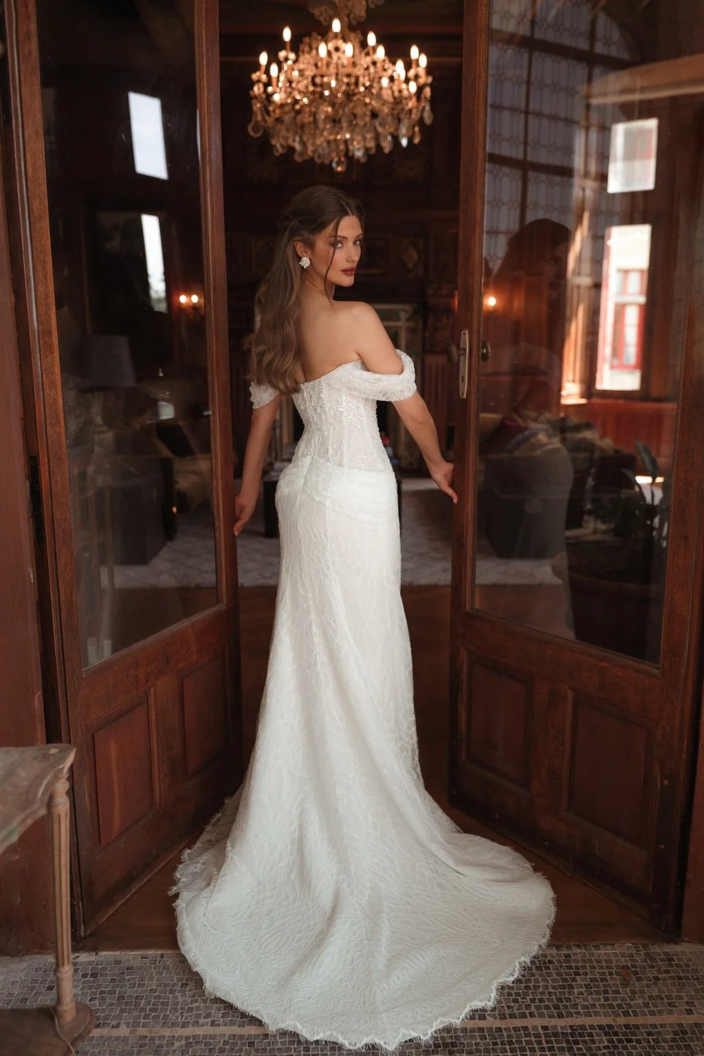 CORTEZ is an exquisite wedding dress made of delicate Guipure lace, embroidered with sequins and decorated with beaded flowers on top. The on-trend of incorporating draping into your wedding aesthetic features on the hips of CORTEZ. The lowered strap
