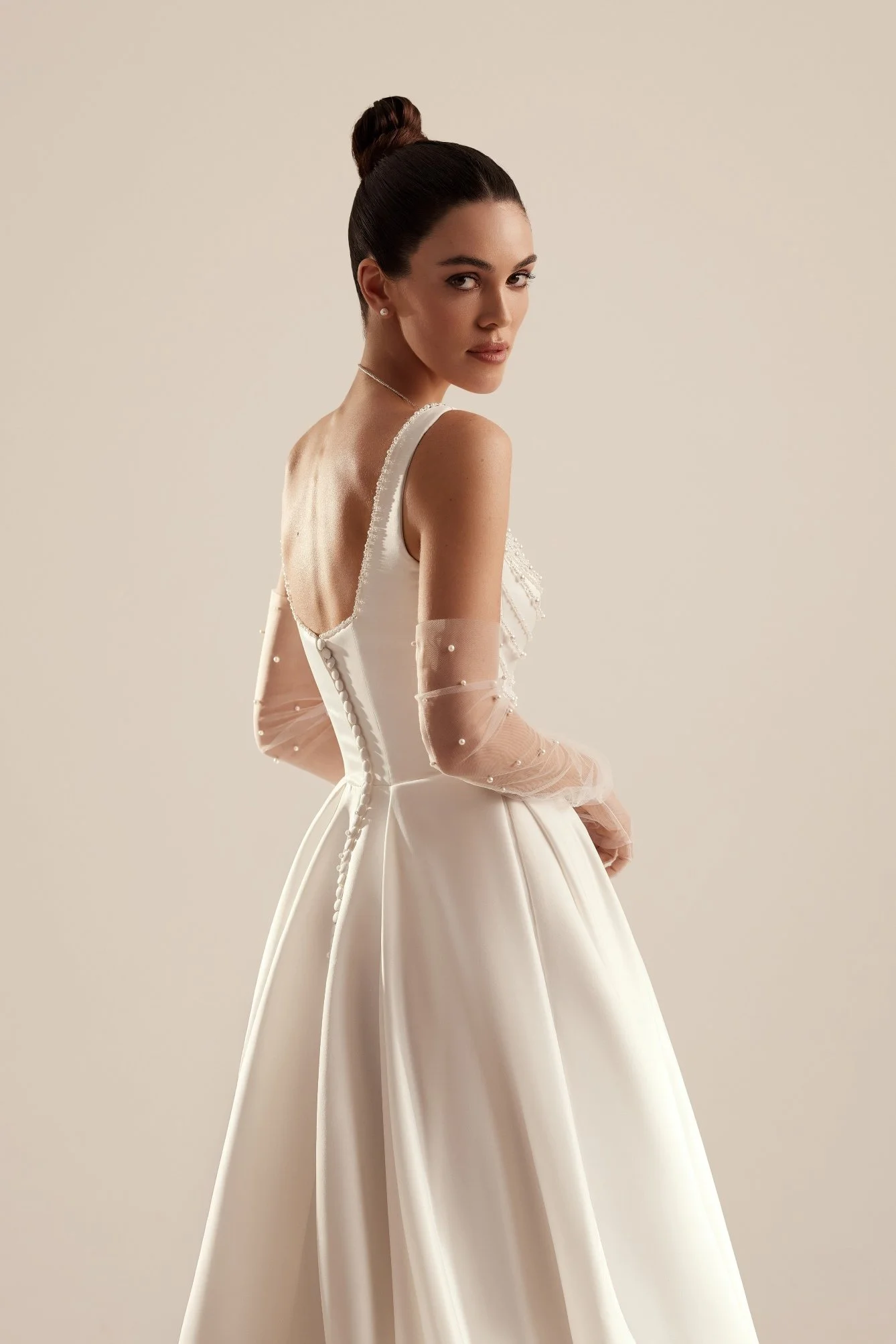 PATRICE is an elegant soft satin bridal A-line gown. Perfect for brides who want a classic with modern pearl accents. Exclusively available at Spellbound Bridal, Wicklow, Ireland.
Dress Designer: Katy Korso