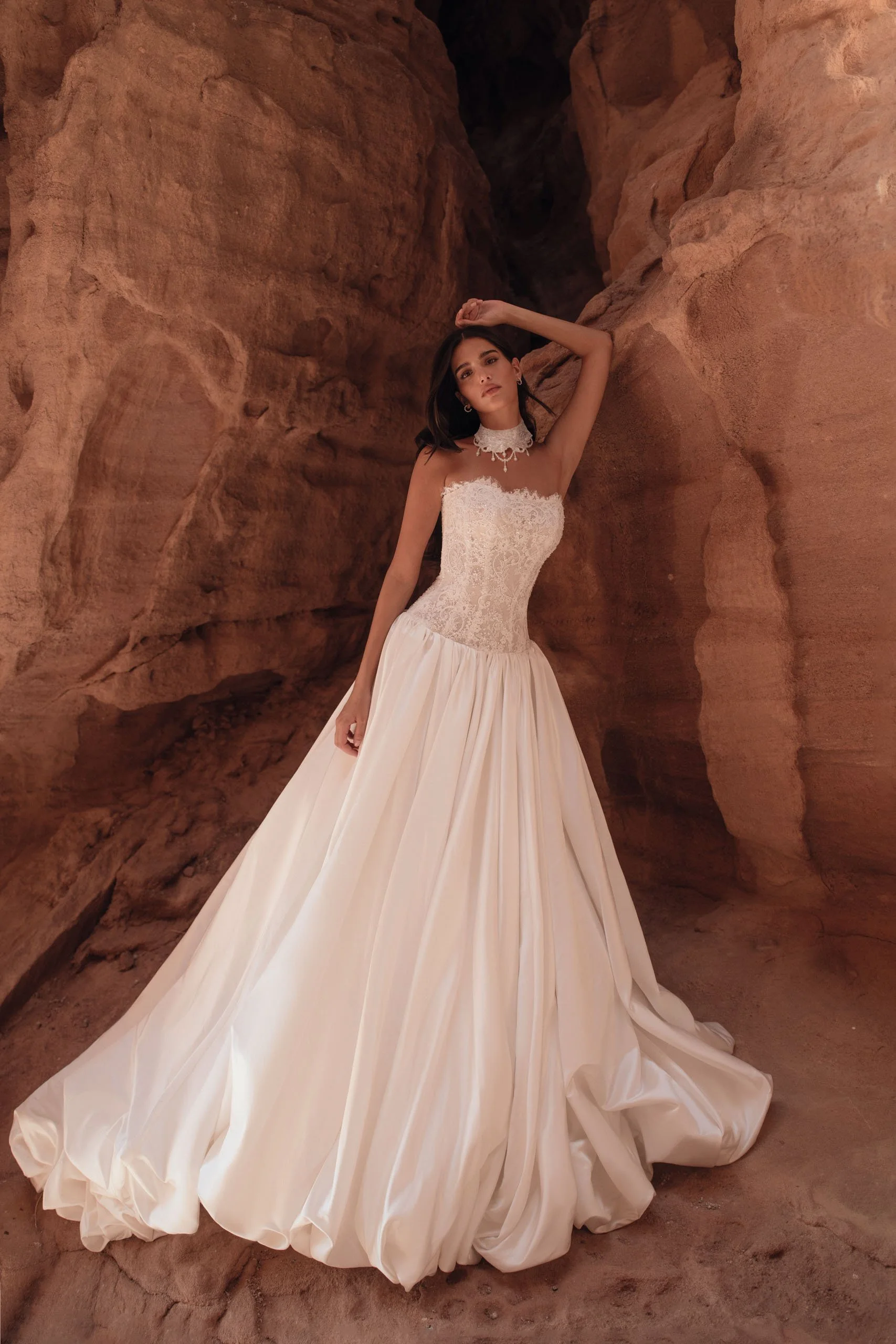 Discover the AMAYA wedding dress by Katy Corso at Spellbound Bridal. A strapless lace corset gown with dropped waist and voluminous satin bubble skirt.