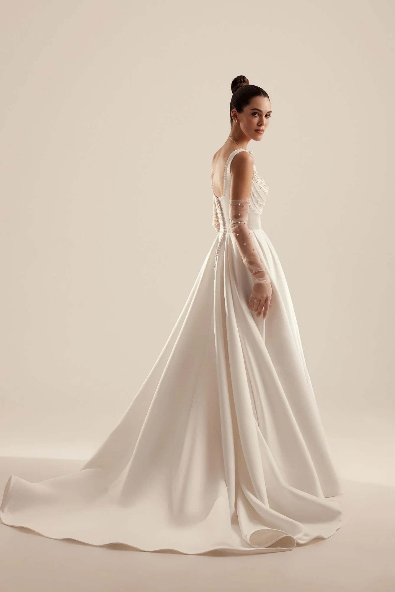 PATRICE is an elegant soft satin bridal A-line gown. Perfect for brides who want a classic with modern pearl accents. Exclusively available at Spellbound Bridal, Wicklow, Ireland.
Dress Designer: Katy Korso