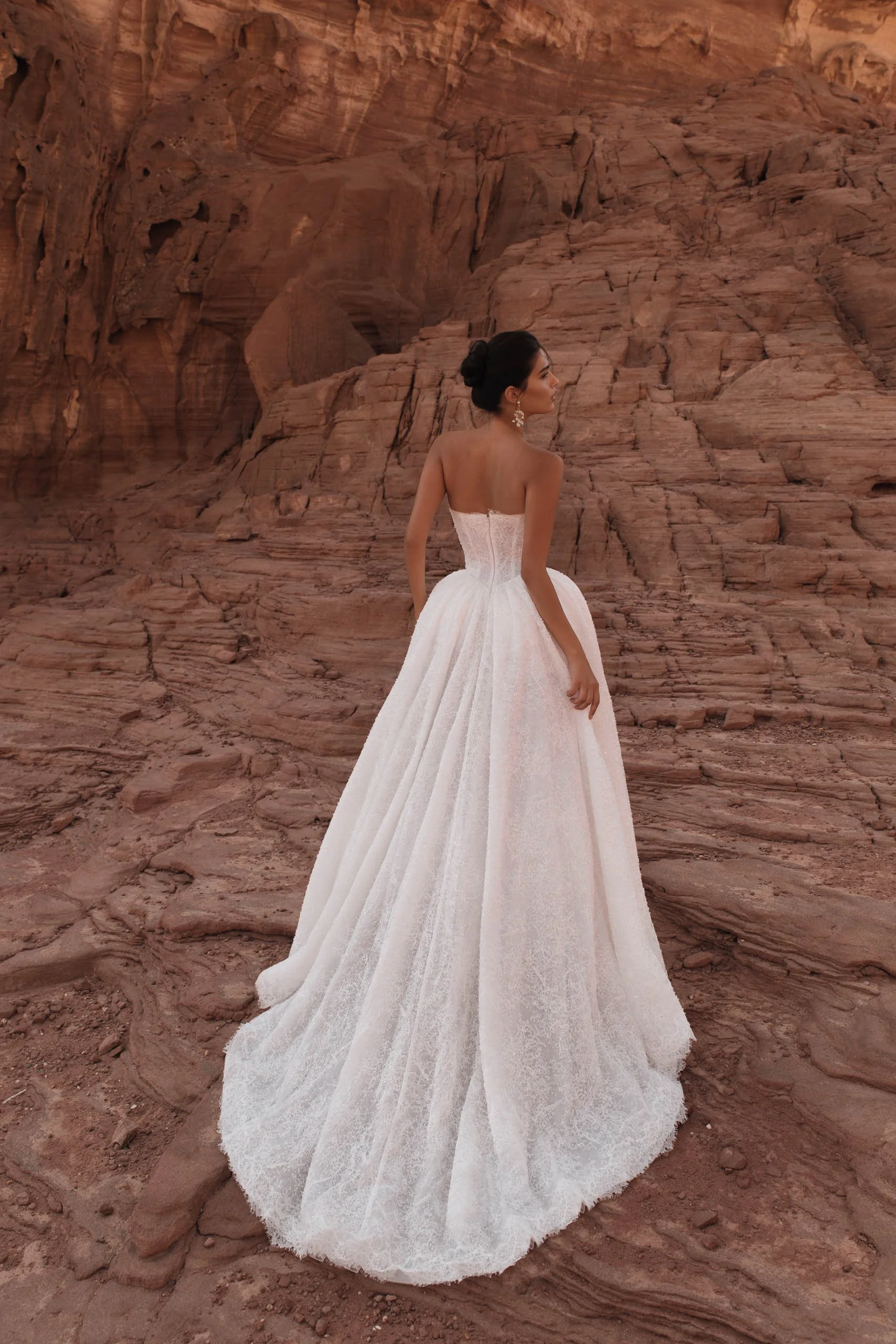 Discover the Betta wedding dress at Spellbound Bridal. A strapless princess gown in Chantilly lace with pearl detailing, voluminous skirt and detachable ruffles. Try her on in Wicklow, Ireland.