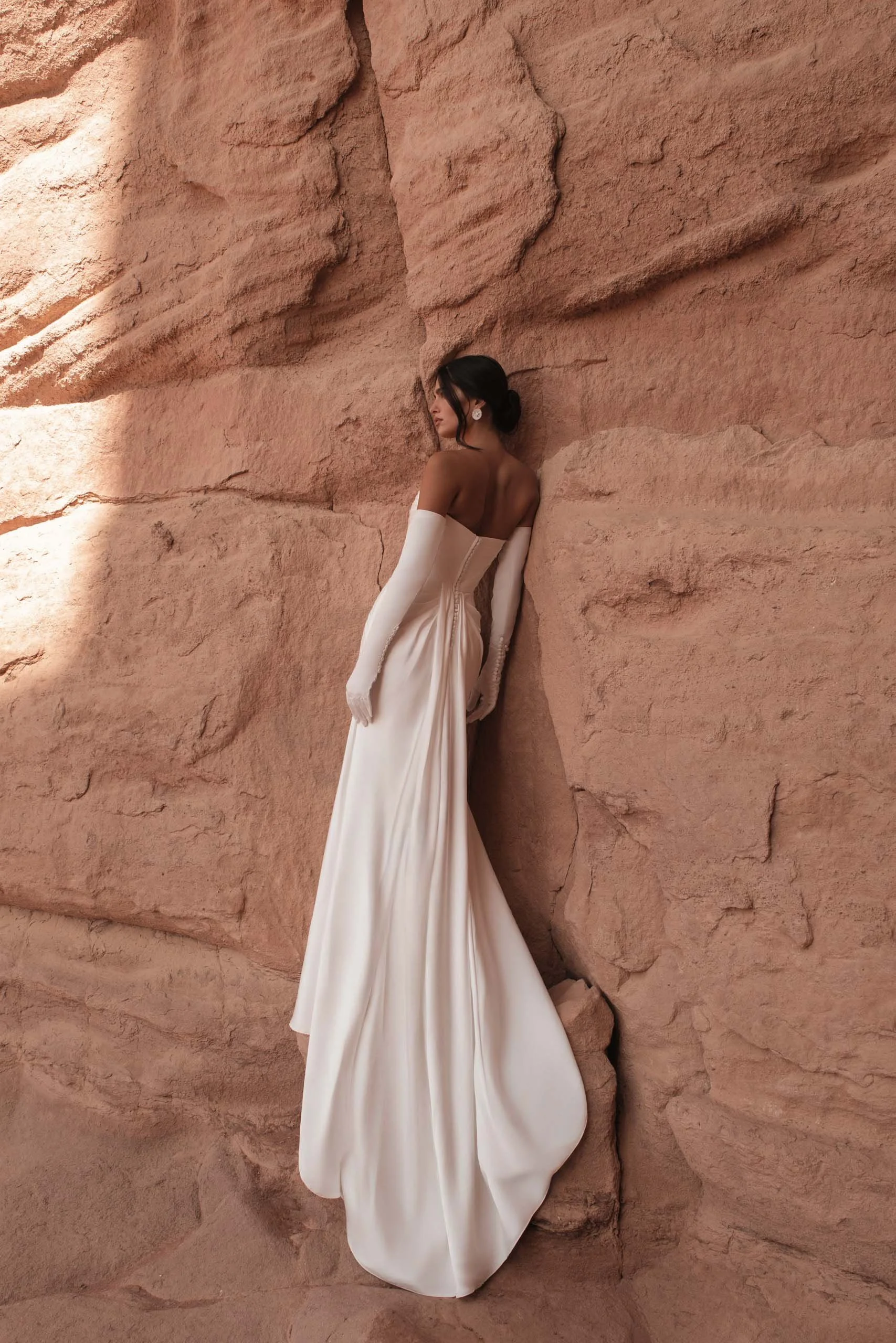 Crafted in luminous ivory satin, ORI is the bridal gown embodiment of modern goddess elegance. Designer: Katy Corso. Exclusive to Spellbound Bridal, Wicklow, Ireland.