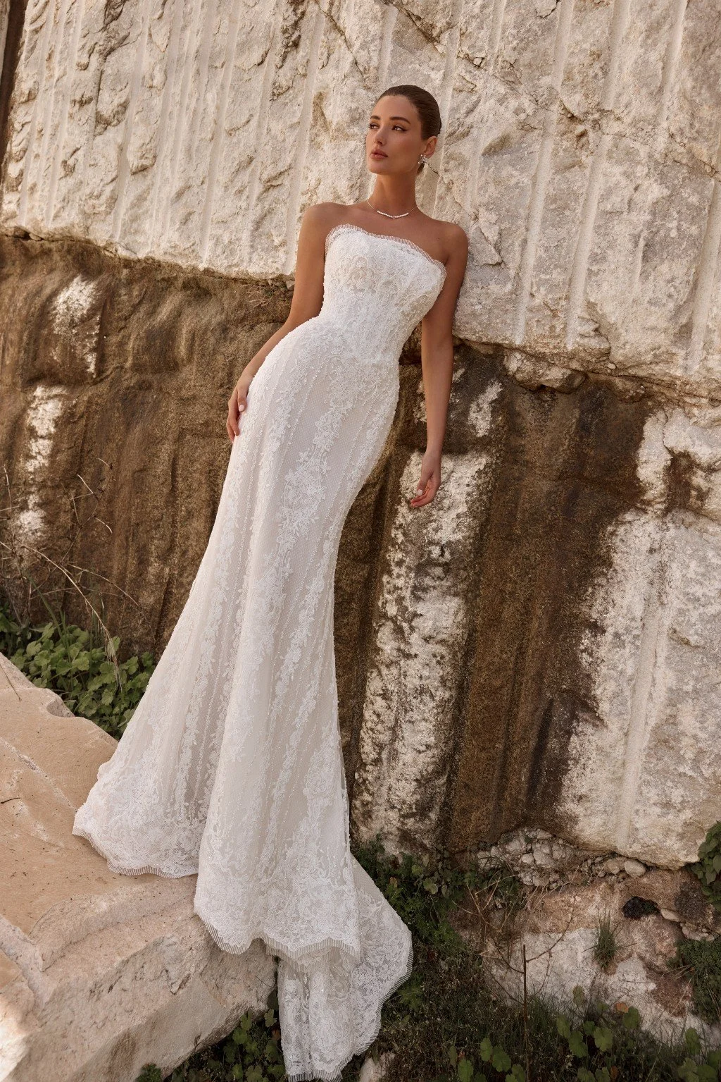 Discover Persephone by Katy Corso at Spellbound Bridal. An embellished guipure lace wedding dress with an optional sculpted corset overskirt for two striking bridal looks.