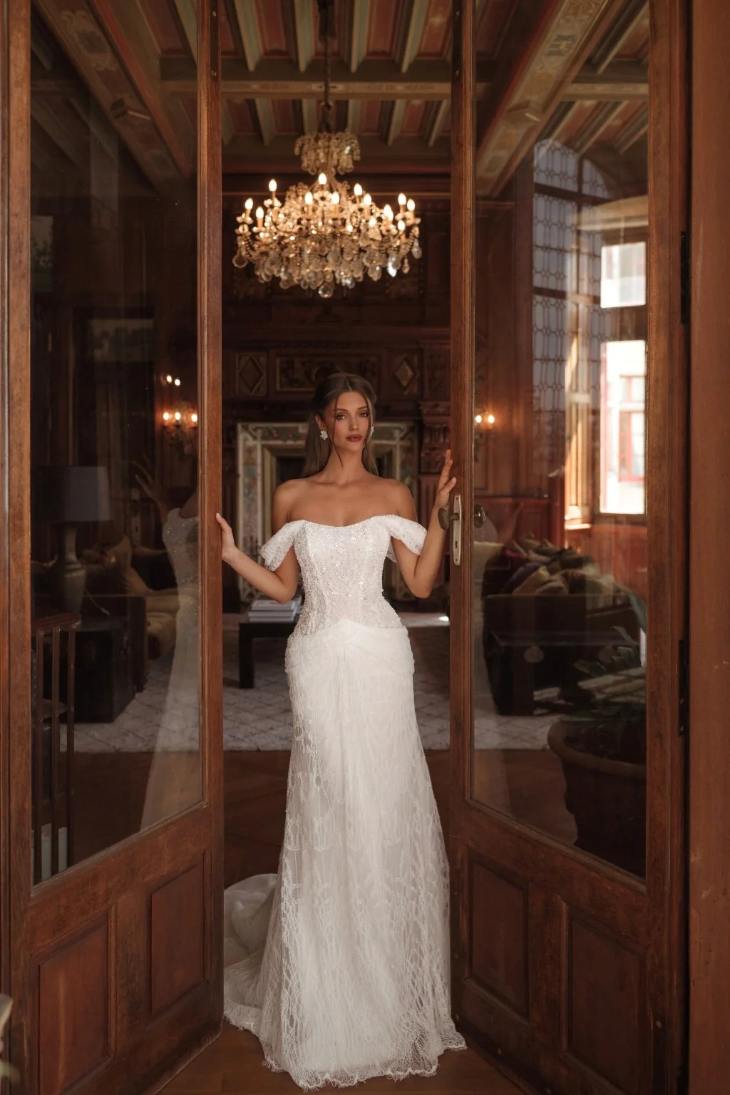 CORTEZ is an exquisite wedding dress made of delicate Guipure lace, embroidered with sequins and decorated with beaded flowers on top. The on-trend of incorporating draping into your wedding aesthetic features on the hips of CORTEZ. The lowered strap