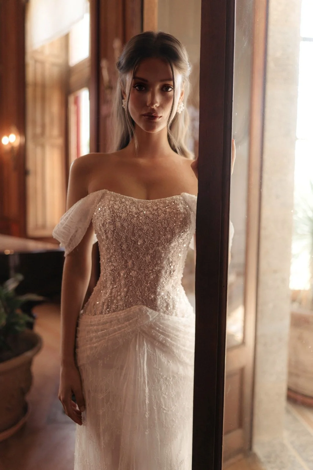 CORTEZ is an exquisite wedding dress made of delicate Guipure lace, embroidered with sequins and decorated with beaded flowers on top. The on-trend of incorporating draping into your wedding aesthetic features on the hips of CORTEZ. The lowered strap