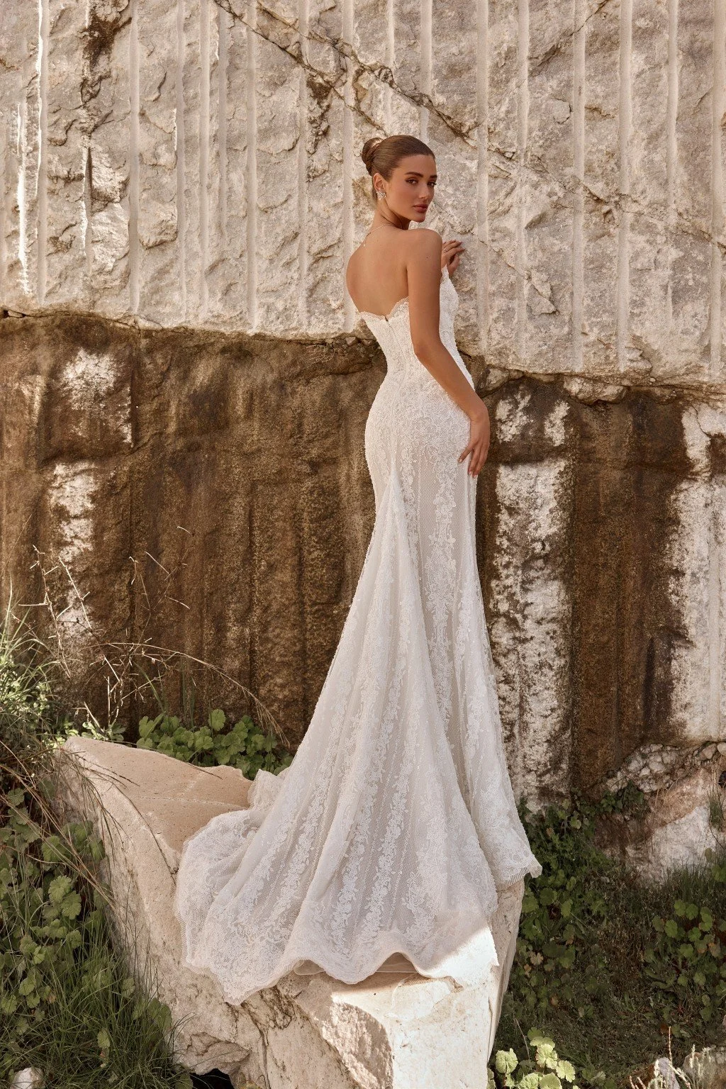 Discover Persephone by Katy Corso at Spellbound Bridal. An embellished guipure lace wedding dress with an optional sculpted corset overskirt for two striking bridal looks.