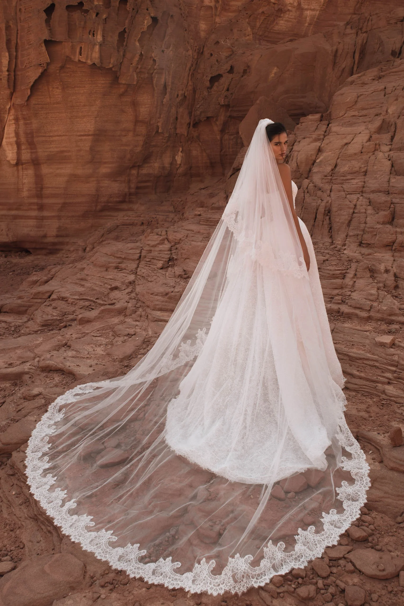 Discover the Betta wedding dress at Spellbound Bridal. A strapless princess gown in Chantilly lace with pearl detailing, voluminous skirt and detachable ruffles. Try her on in Wicklow, Ireland.