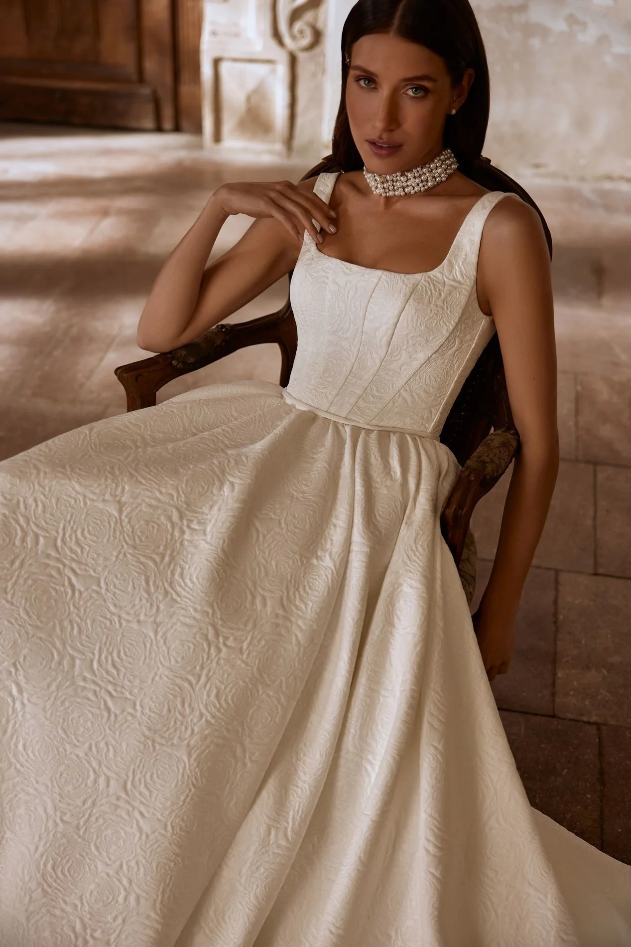 MARVIN is an exquisite square neckline princess ballgown wedding dress available in two luxury jacquard fabric variations. This textured look bridal gown with wide straps and a long train is classically elegant. Exclusively available at Spellbound Br