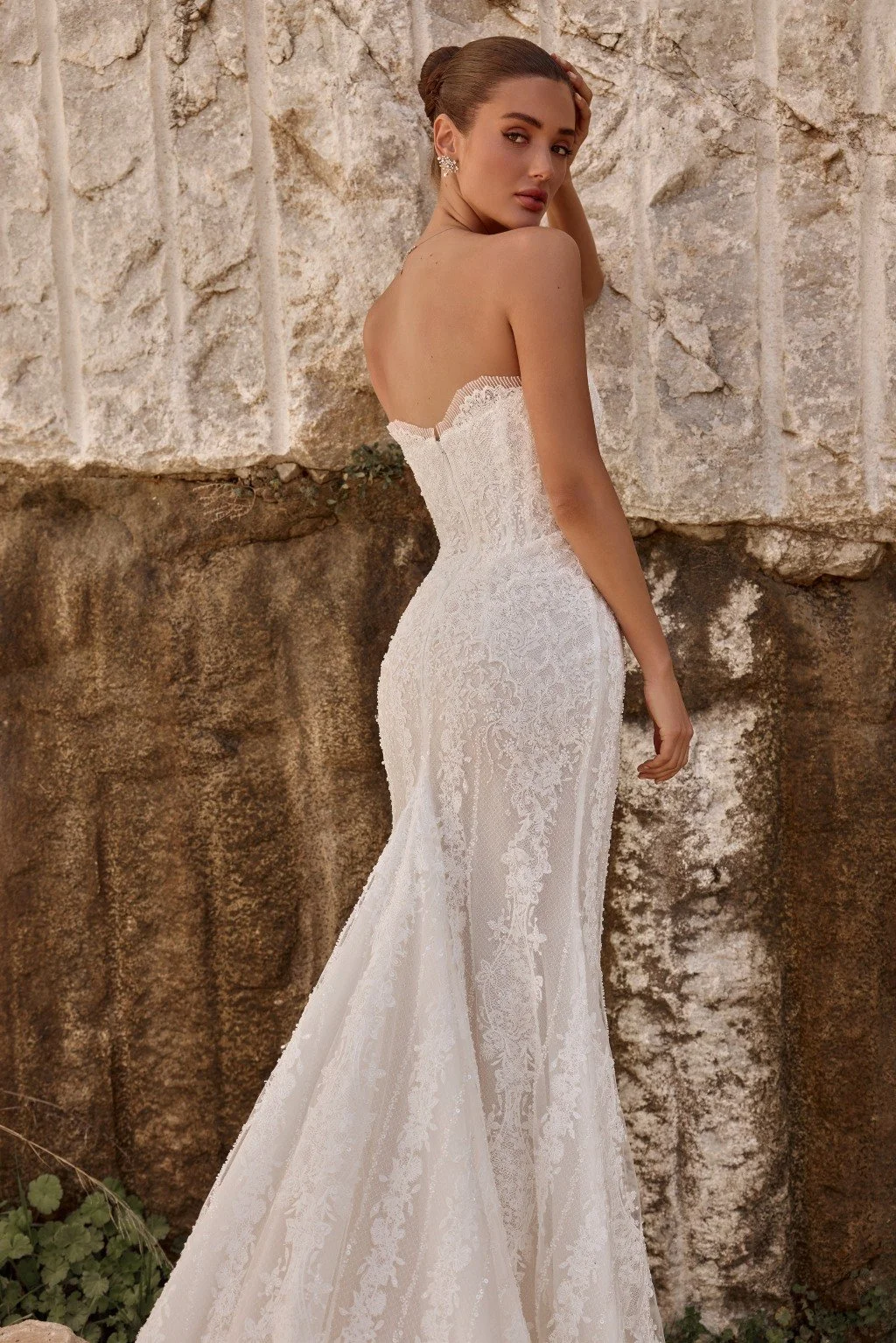 Discover Persephone by Katy Corso at Spellbound Bridal. An embellished guipure lace wedding dress with an optional sculpted corset overskirt for two striking bridal looks.