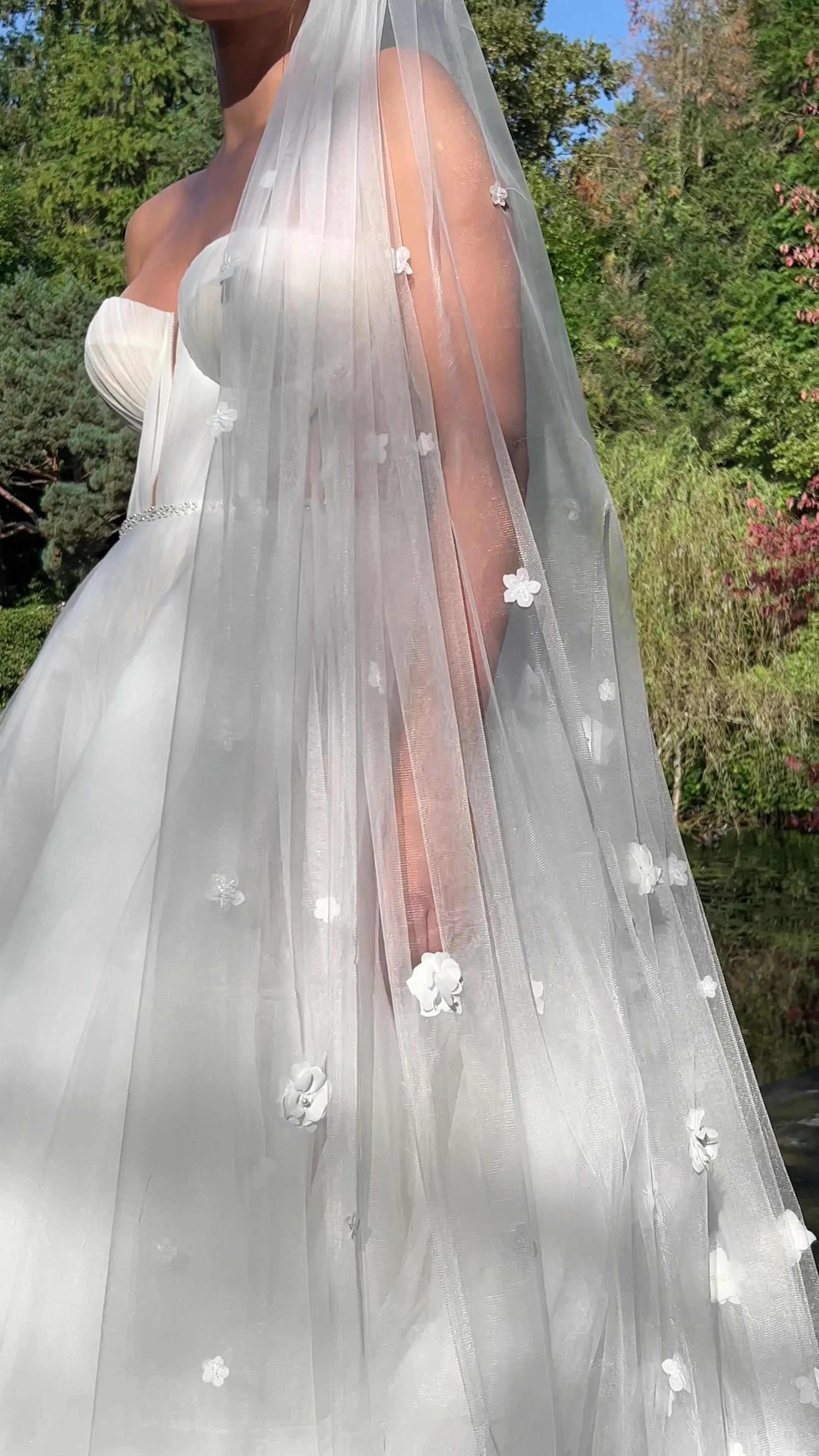 Naomi cathedral-length bridal veil with delicate 3D floral appliqué on soft sheer tulle.