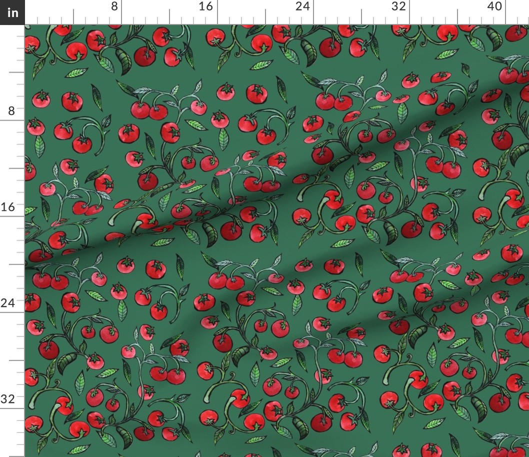 Close-up of green fabric with a pattern of red cherry illustrations with green leaves, and a centimeter ruler on the top edge.